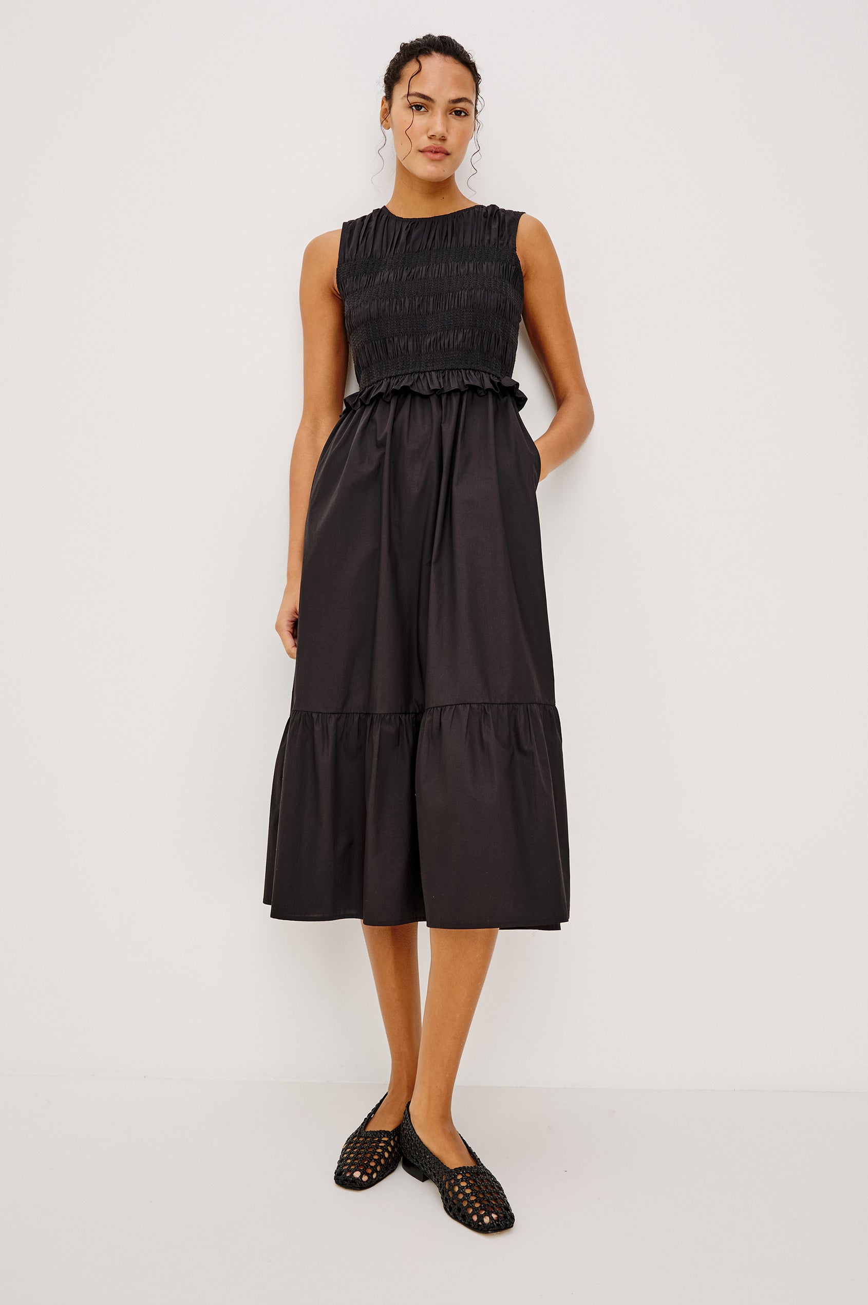 Rialto Midi Dress in Lightly Textured Poplin With Smocked Bodice, Ruffle Trim, Tiered Skirt, and Back Keyhole With Button-and-Loop Closure in Black Colorway - Full Body Front View Featured on Model