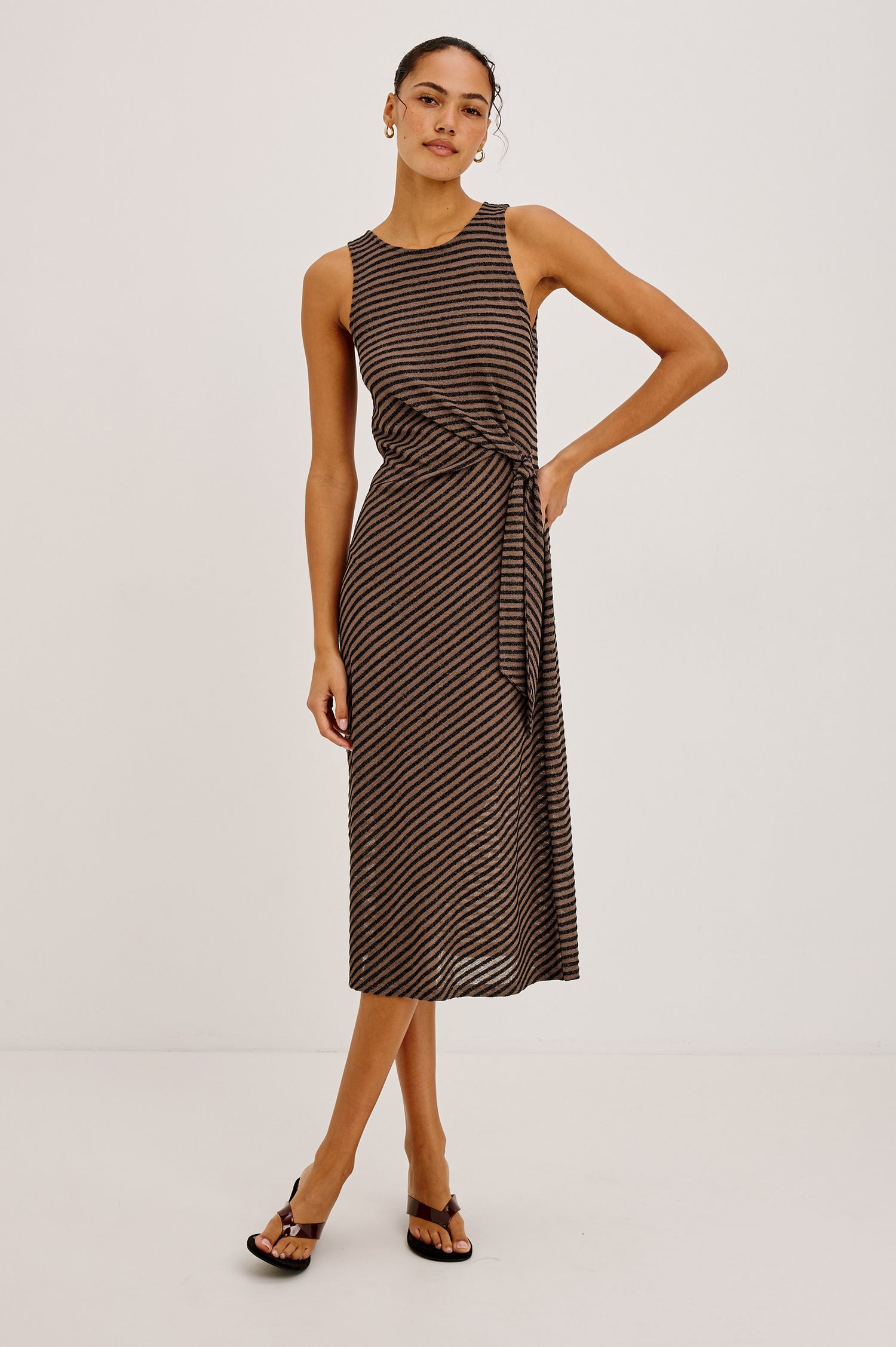 Ricky Midi Dress in Slinky Textured Fabric With Sleeveless Cut, and Adjustable Ties at Side Waist in Cocoa Stripe Colorway - Full Body Front View Featured on Model