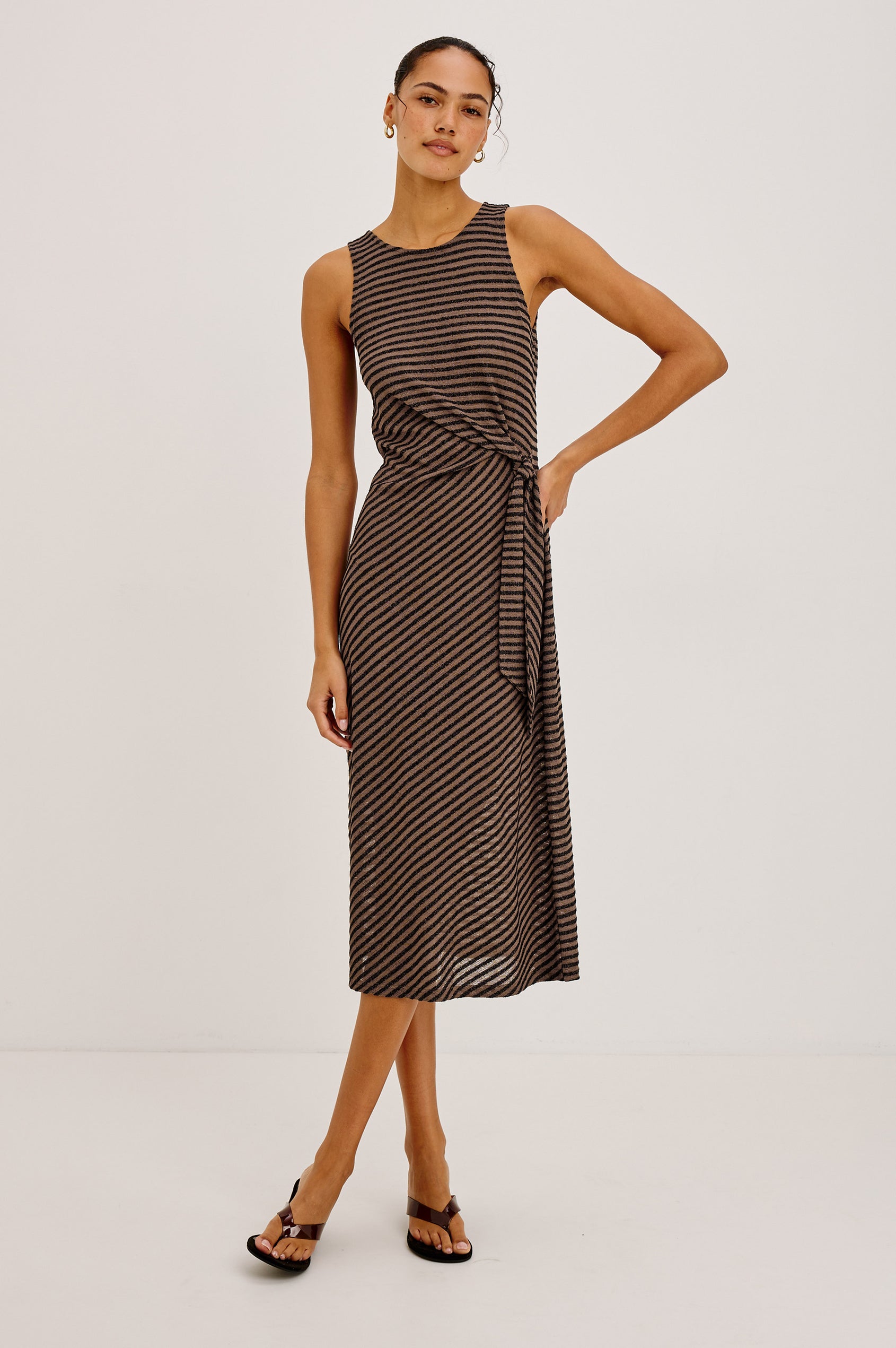 Ricky Midi Dress in Slinky Textured Fabric With Sleeveless Cut, and Adjustable Ties at Side Waist in Cocoa Stripe Colorway - Full Body Front View Featured on Model