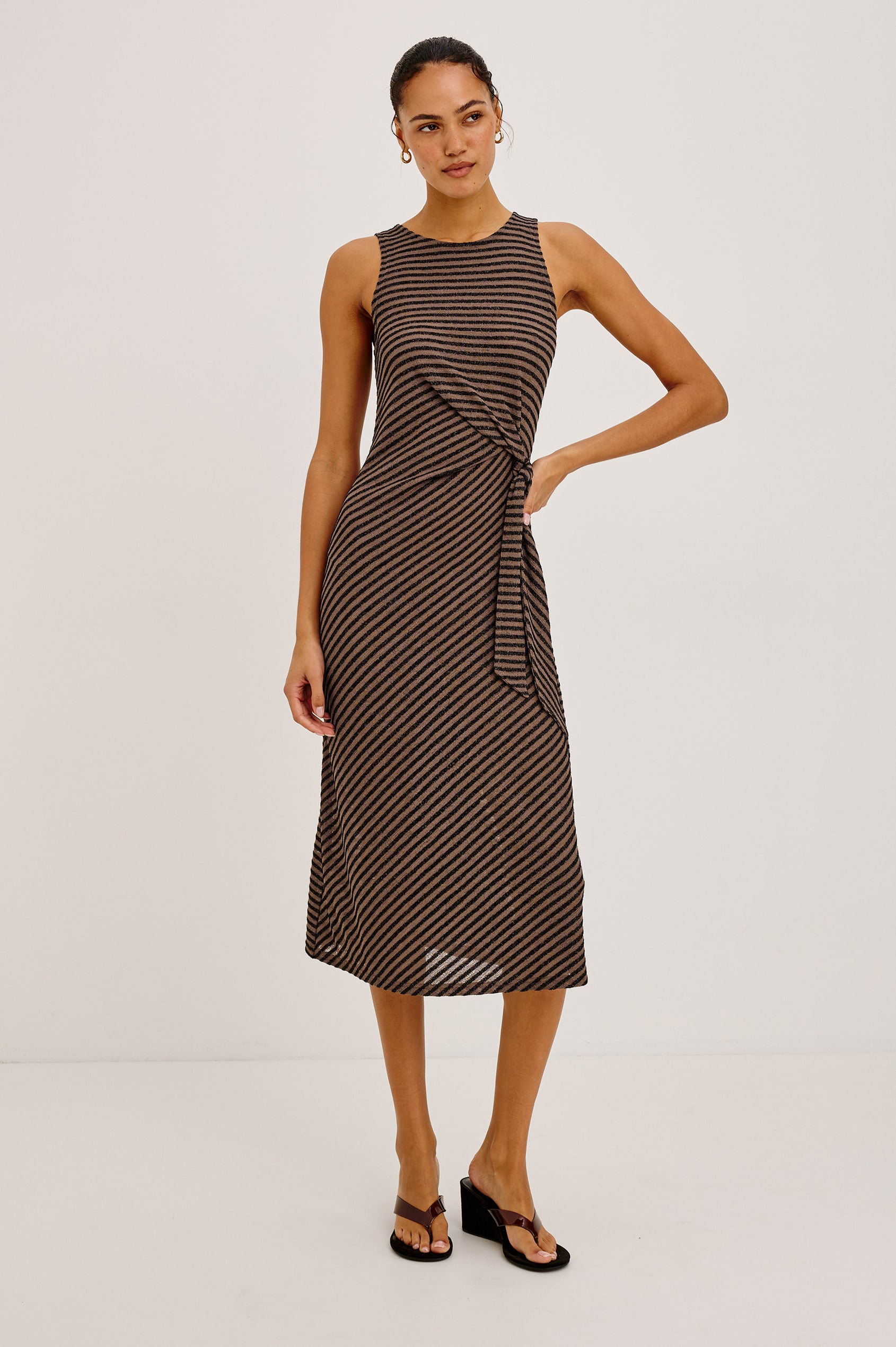 Ricky Midi Dress in Slinky Textured Fabric With Sleeveless Cut, and Adjustable Ties at Side Waist in Cocoa Stripe Colorway - Full Body Front View Featured on Model