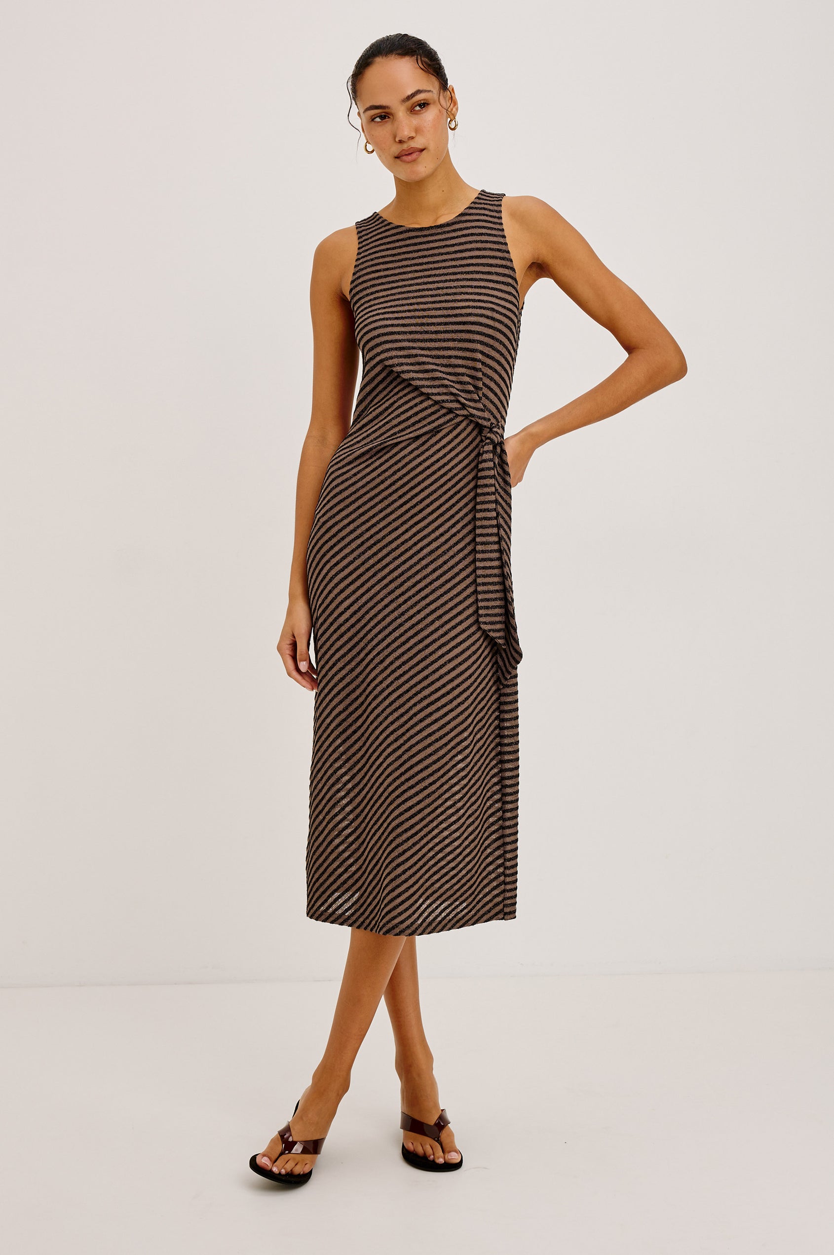Ricky Midi Dress in Slinky Textured Fabric With Sleeveless Cut, and Adjustable Ties at Side Waist in Cocoa Stripe Colorway - Full Body Front View Featured on Model