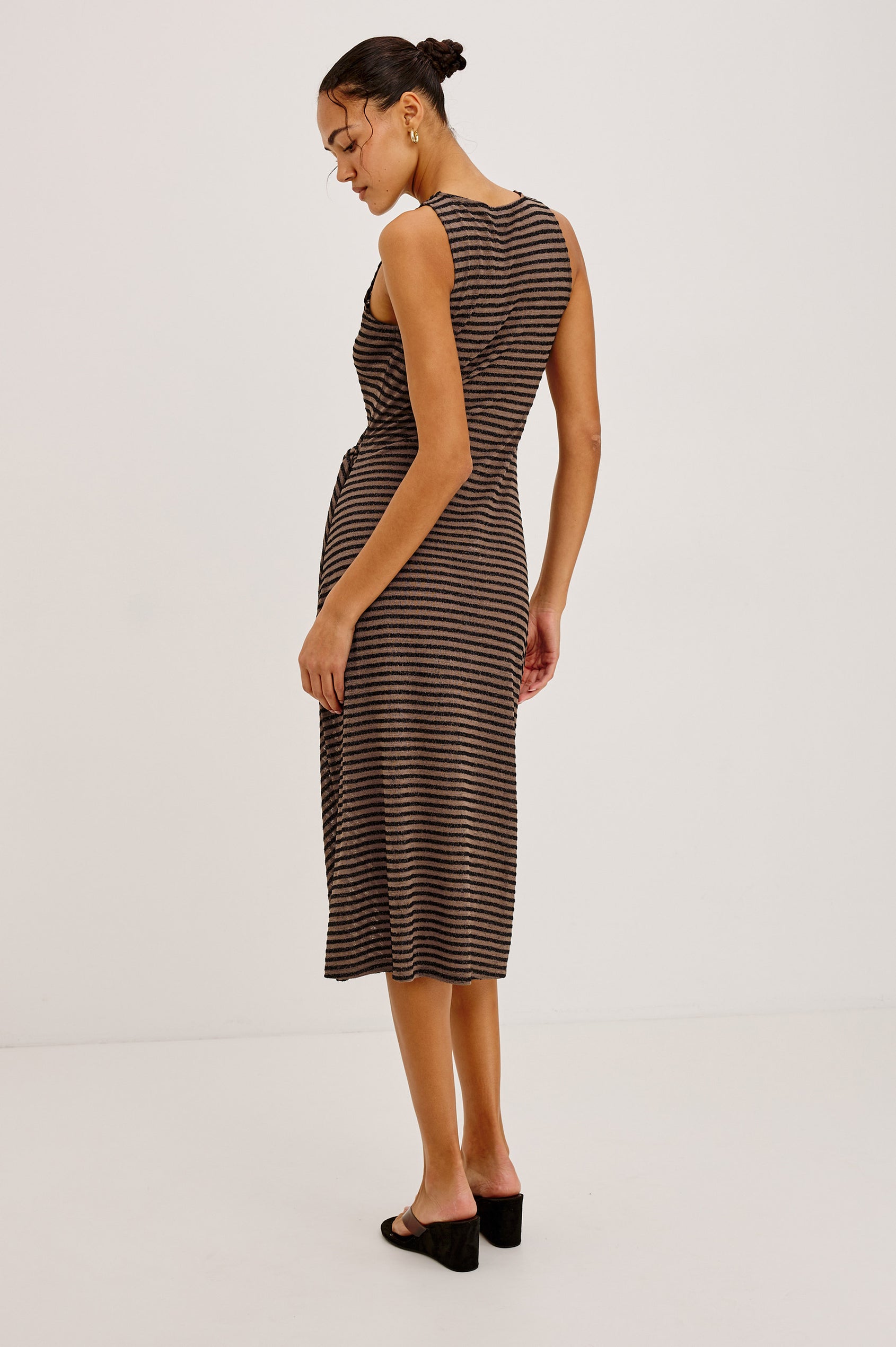 Ricky Midi Dress in Slinky Textured Fabric With Sleeveless Cut, and Adjustable Ties at Side Waist in Cocoa Stripe Colorway - Full Body Back View Featured on Model