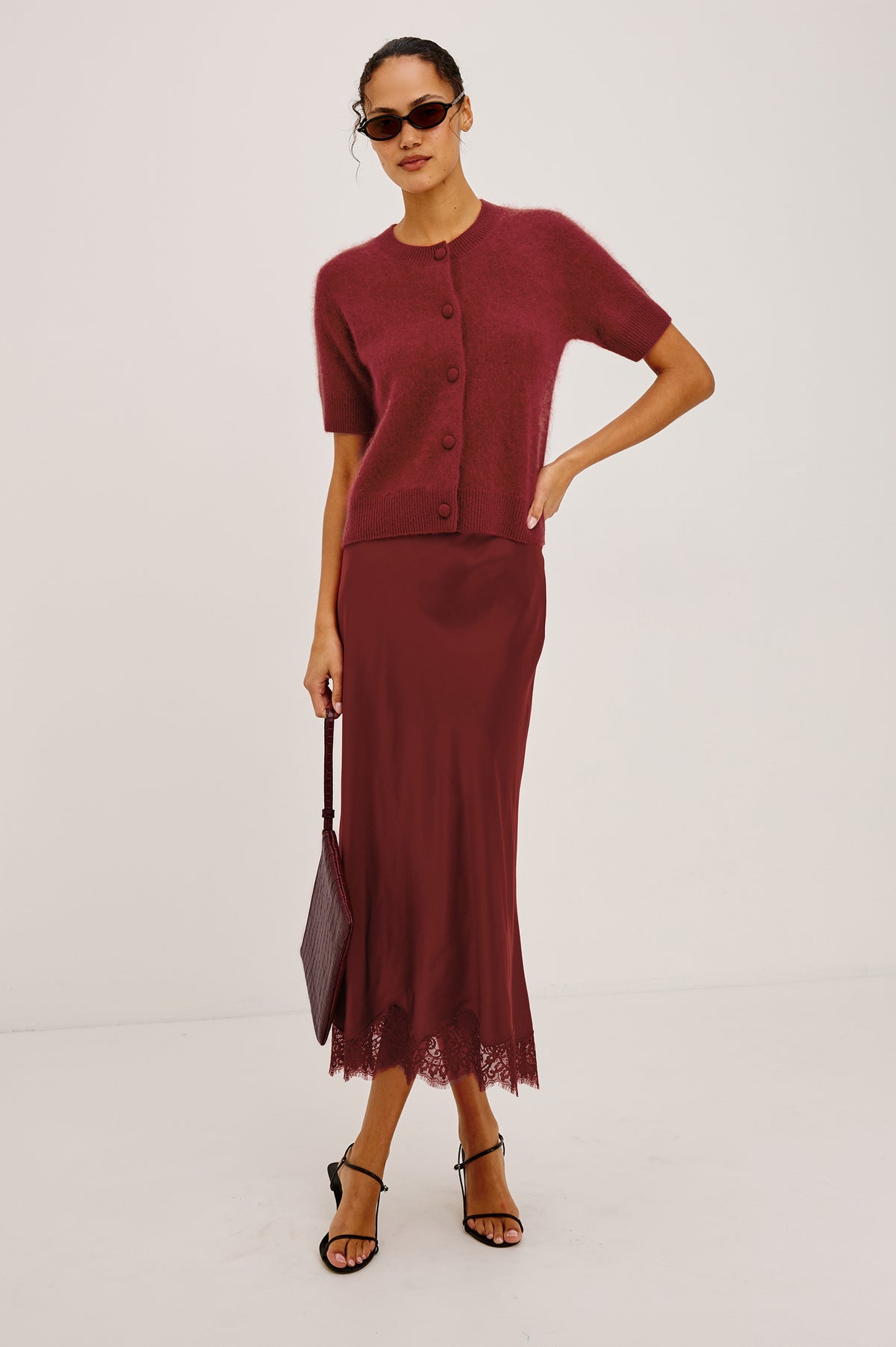 Roman Cardigan Sweater in Brushed Wool With Fluffy Feel With Slightly Cropped Fit, Crew Neck, Self-Covered Front Buttons, Short Sleeves, and Ribbed Trim in Crimson Colorway - Full Body Front View Featured on Model