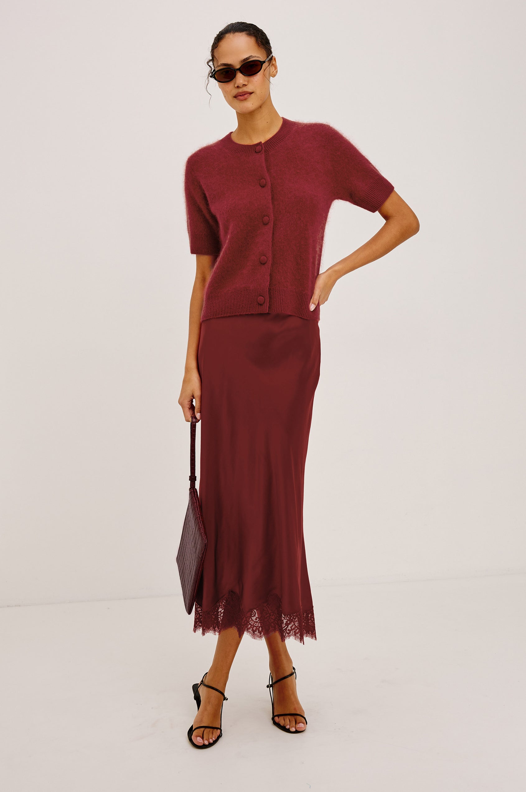 Roman Cardigan Sweater in Brushed Wool With Fluffy Feel With Slightly Cropped Fit, Crew Neck, Self-Covered Front Buttons, Short Sleeves, and Ribbed Trim in Crimson Colorway - Full Body Front View Featured on Model