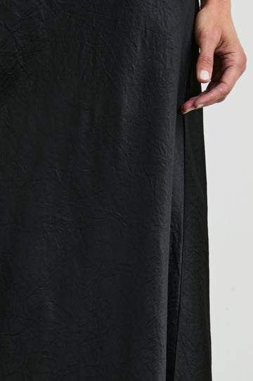 Romina Maxi Skirt in Black Crinkle Colorway - Front View Featured on Model