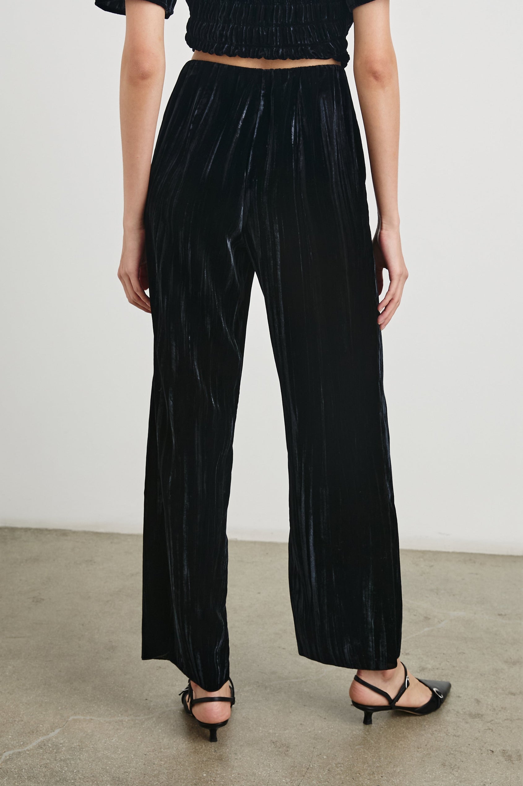Brissa Pants with an Elastic Waist in Black Velvet Colorway - Back View Featured on Model