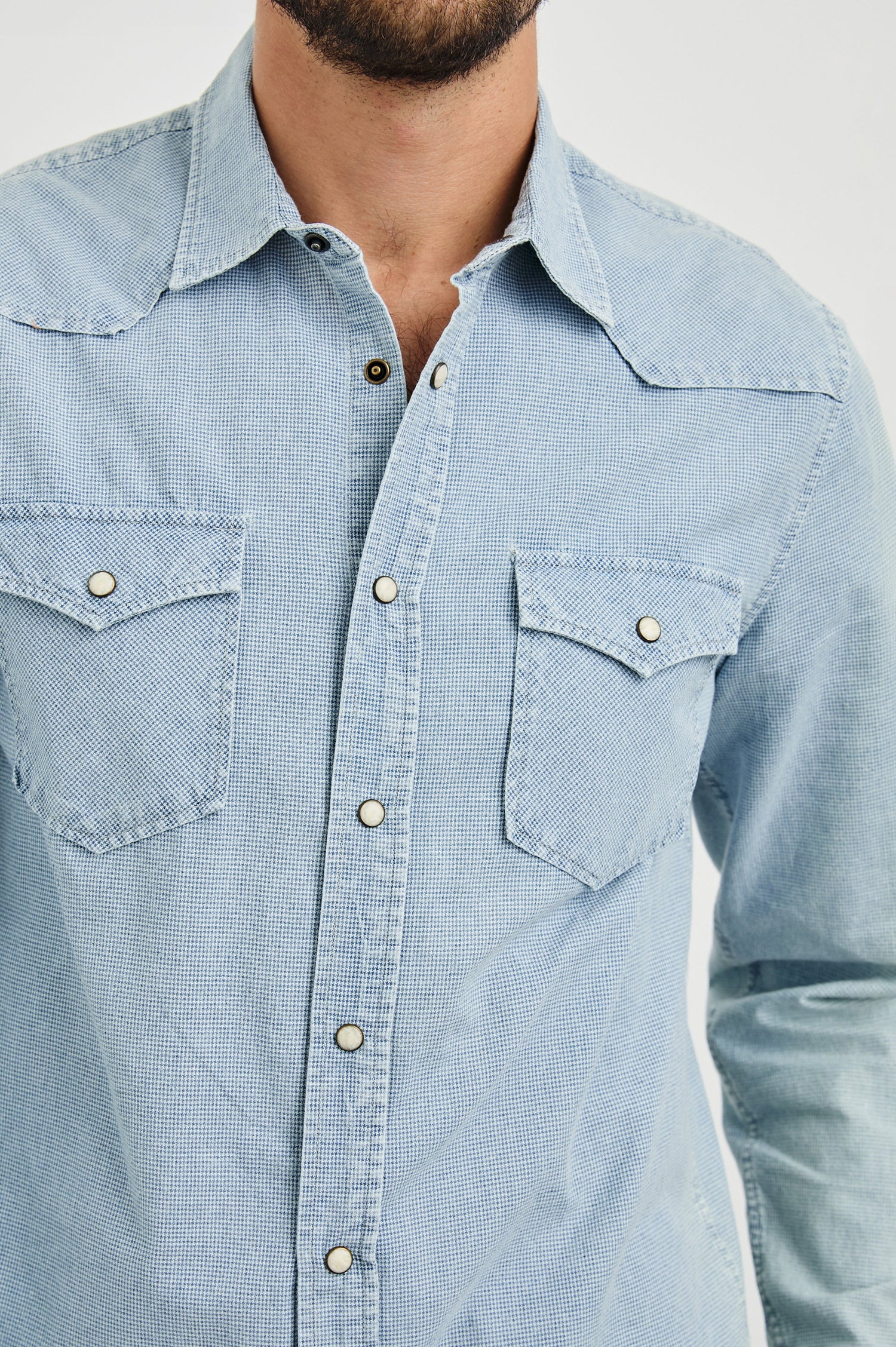 Roy Long-Sleeve with Snap Closure, Two Chest Snap Flap Pockets and Traditional Western Yokes in Sunfaded Indigo Colorway - Front View Featured on Model   