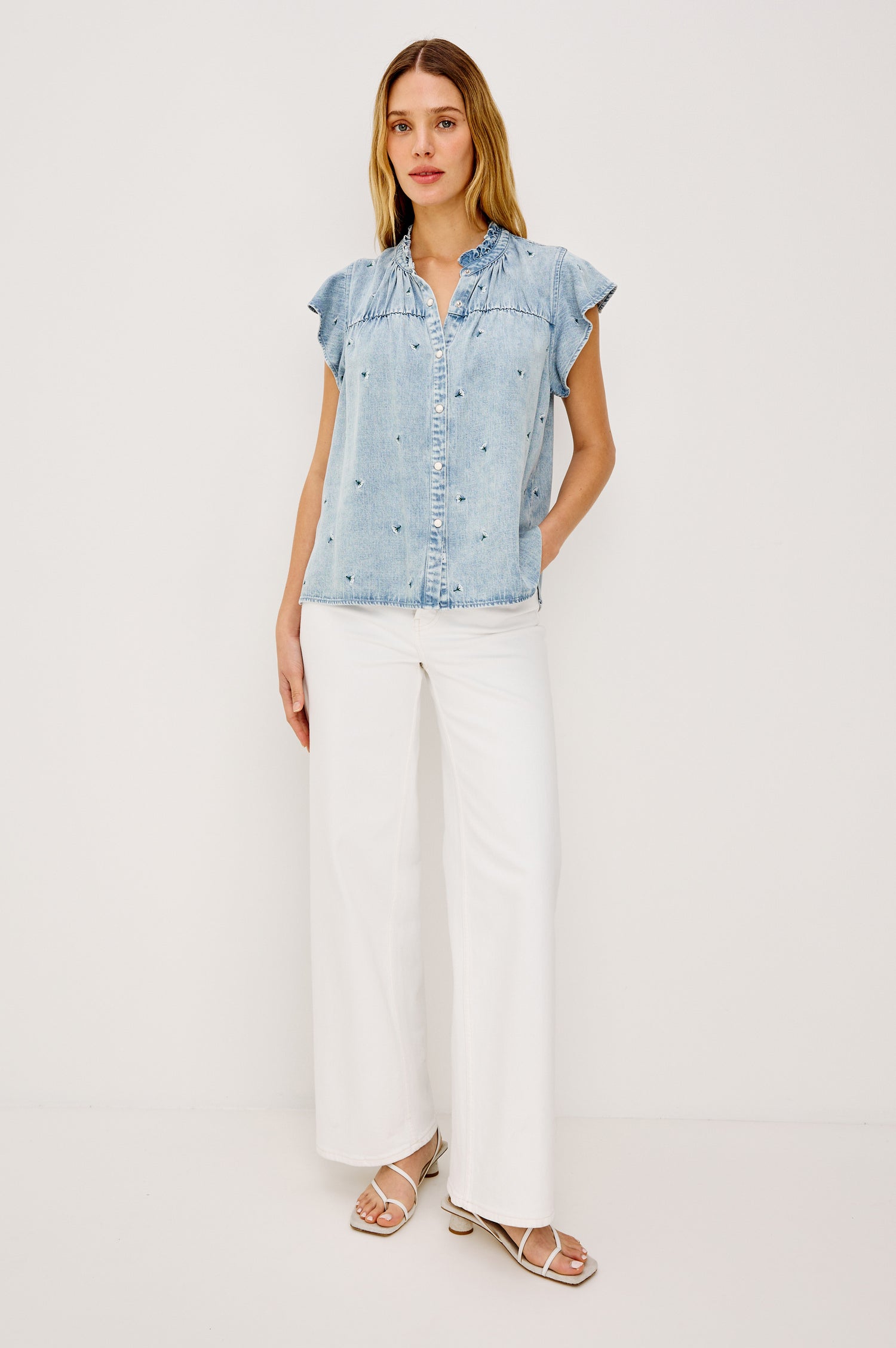 Ruthie Flutter Sleeve High Neck Front Button Ruffle Trim Yoke Detail Top in Ivory Carnations Colorway - Upper Body Front View Featured on Model