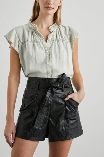 Ruthie Top with Flutter Cap Sleeves, a Ruffled Banded Collar, Buttons Down the Front, and Soft Shirring at Front Yoke in Sage Acid Wash Colorway - Front Tucked View Featured on Model