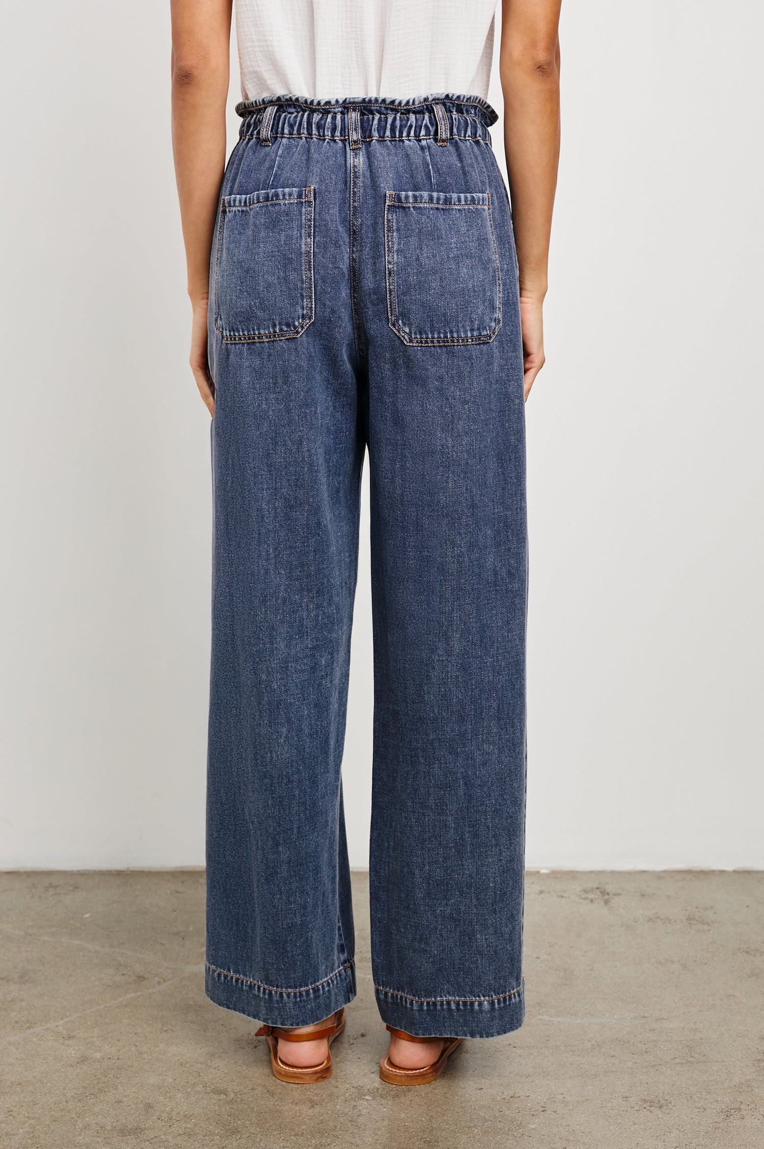 Ryan high rise linen pant with shirred waist and drawstring in dark wash Classic Blue - back view on model