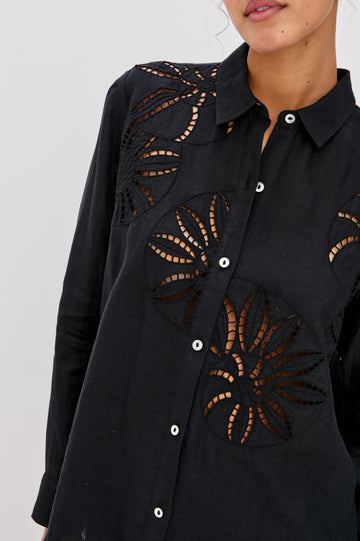 Samar Collared Button Front  Shirt with Long Sleeves and Floral Cutouts in Black Colorway. Front Detailed View Shown on Model.