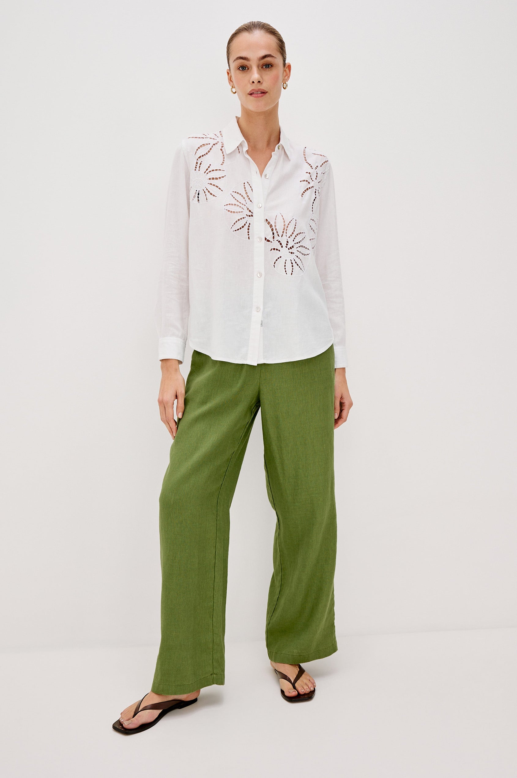 Samar Collared Button Front Top with Long Sleeves and Cutout Flower Details in White Colorway. Full Body Front View Shown on Model.
