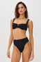 Savannah High Waist Bikini Bottom with Classic Coverage and Fossils Texture in Black Colorway. Front View Shown on Model.