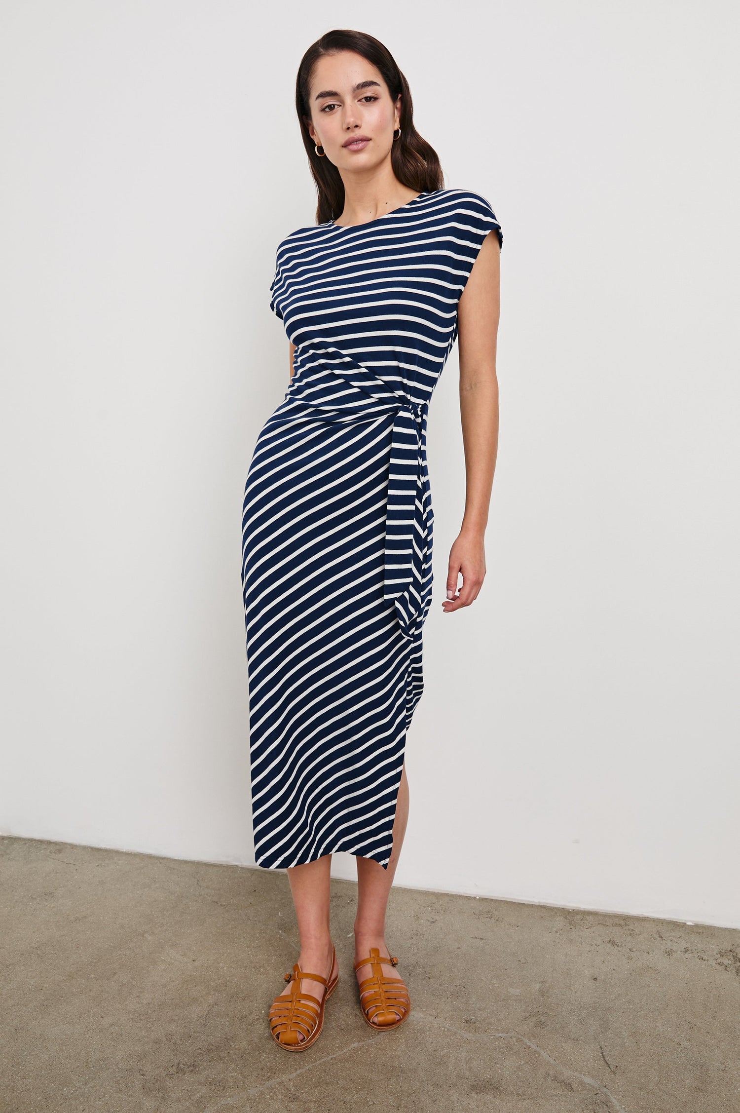 Selah Short Sleeve Jersey Dress With Side Tie In Colorway Navy Ivory Stripe -  Full Front Body View Featured On Model In Motion