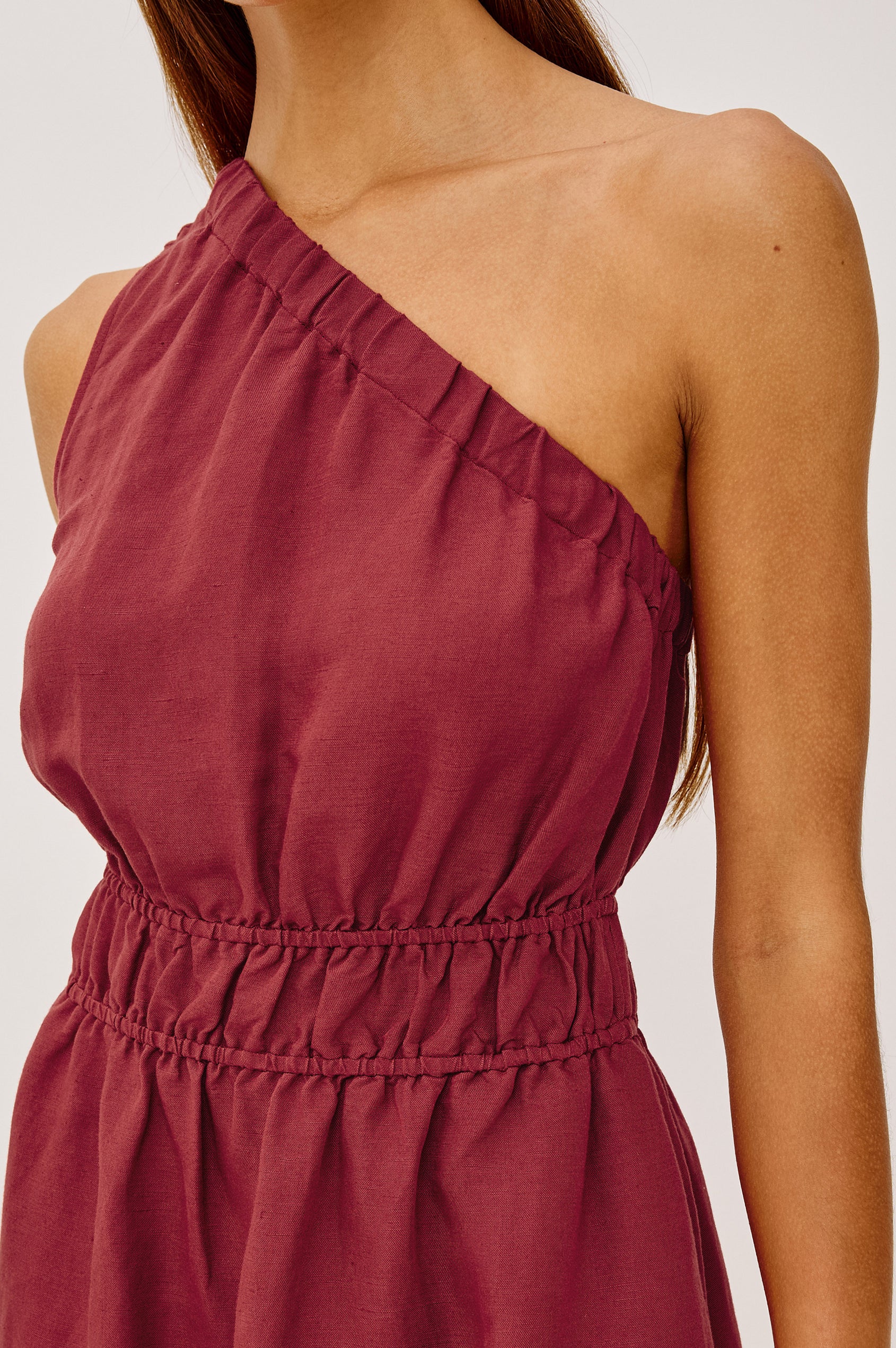 Selani Midi Dress in Linen-Viscose Blend With One-Shoulder Neckline, Laddered Elastic Waist, Side Slits, Side Pockets, and Softly Voluminous Skirt in Spice Colorway - Upper Body Front View Featured on Model