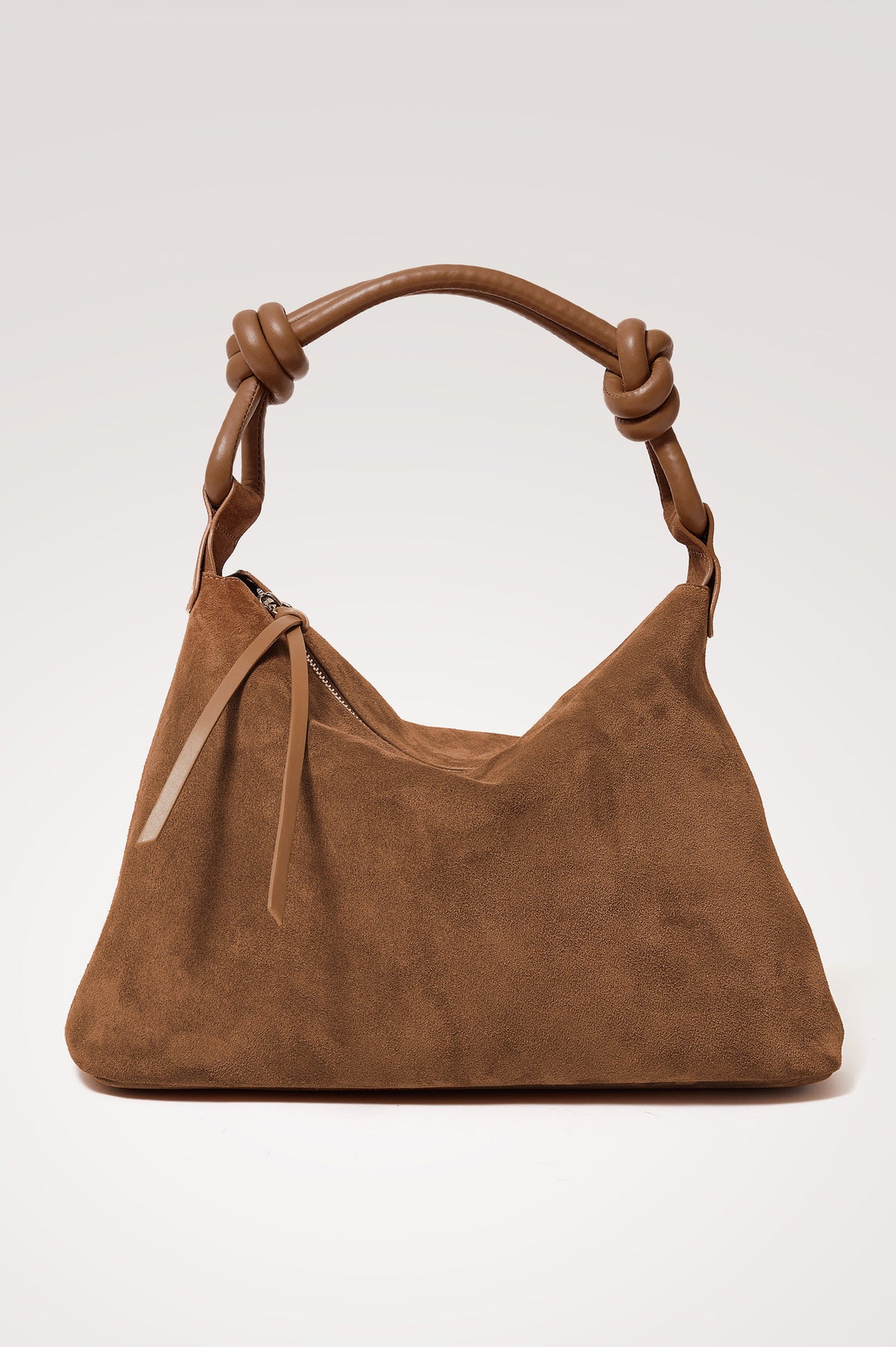 Siena Hobo Bag in Suede With Knotted Top Strap, Zip Closure With Fringe Tassel Pull, Microsuede Lining, Snap-Button Slip Pocket and Foil Logo Stamp at Interior in Camel Suede Colorway - Front view featured