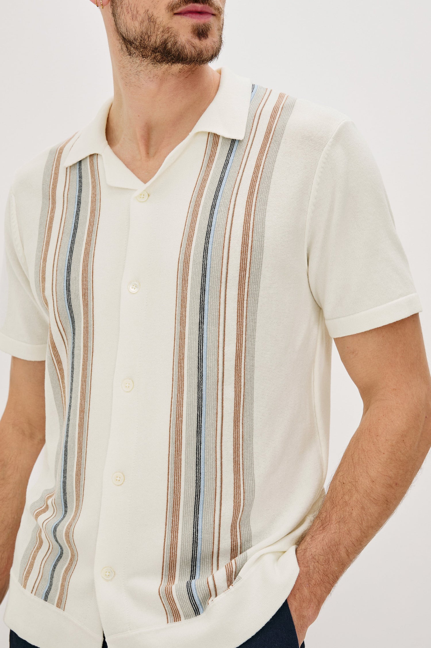 Silas Short-Sleeve Button Up in White Multi Colorway, with two front sections of vertical stripes in Blues, brown and grey - Front Detail View Featured on Model