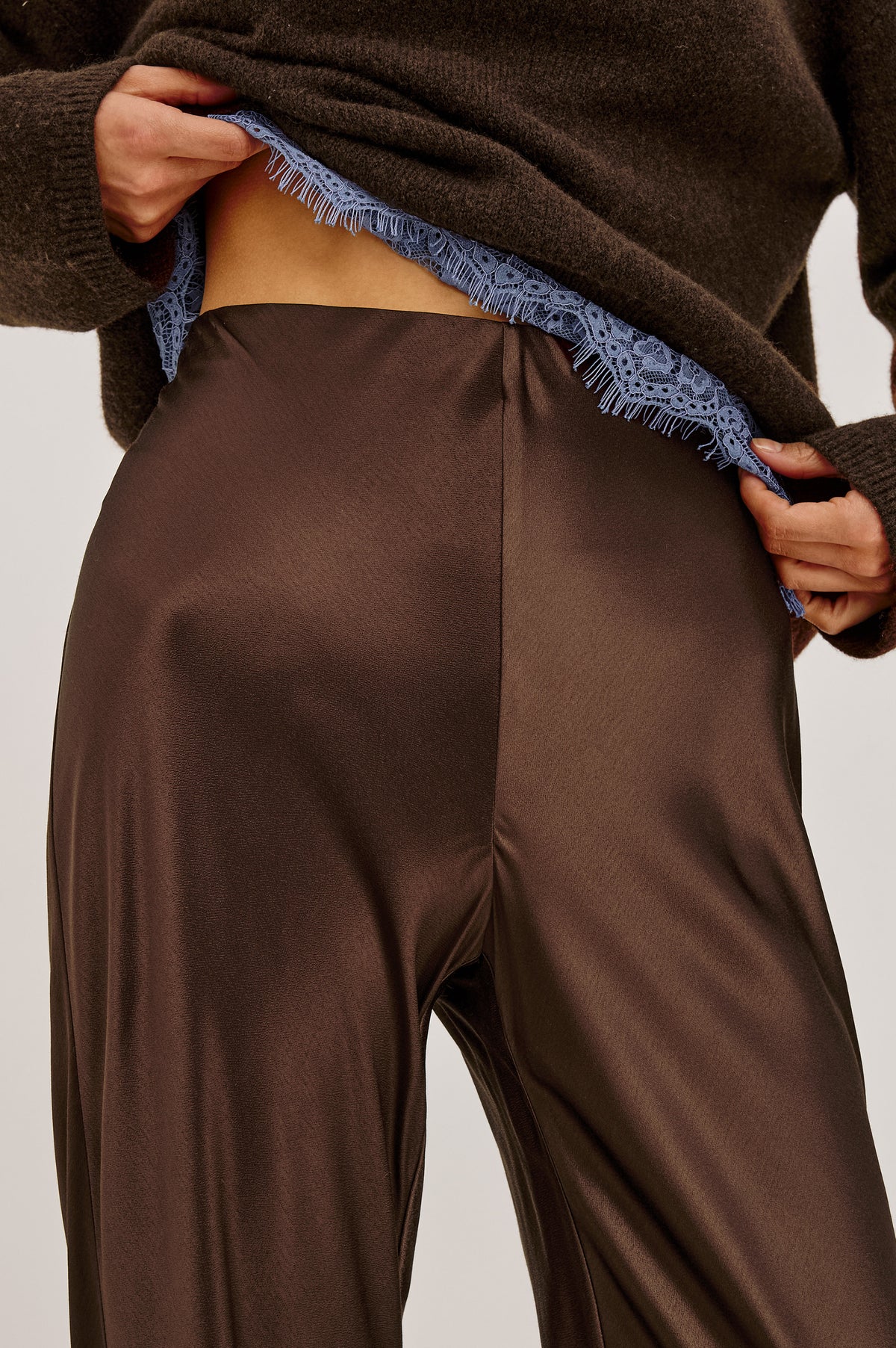 Silvi High-Waisted Pant in Metallic Satin Back Crepe With Elastic Waistband and Straight Legs in Espresso Colorway - Upper Body Front Detail View Featured on Model.