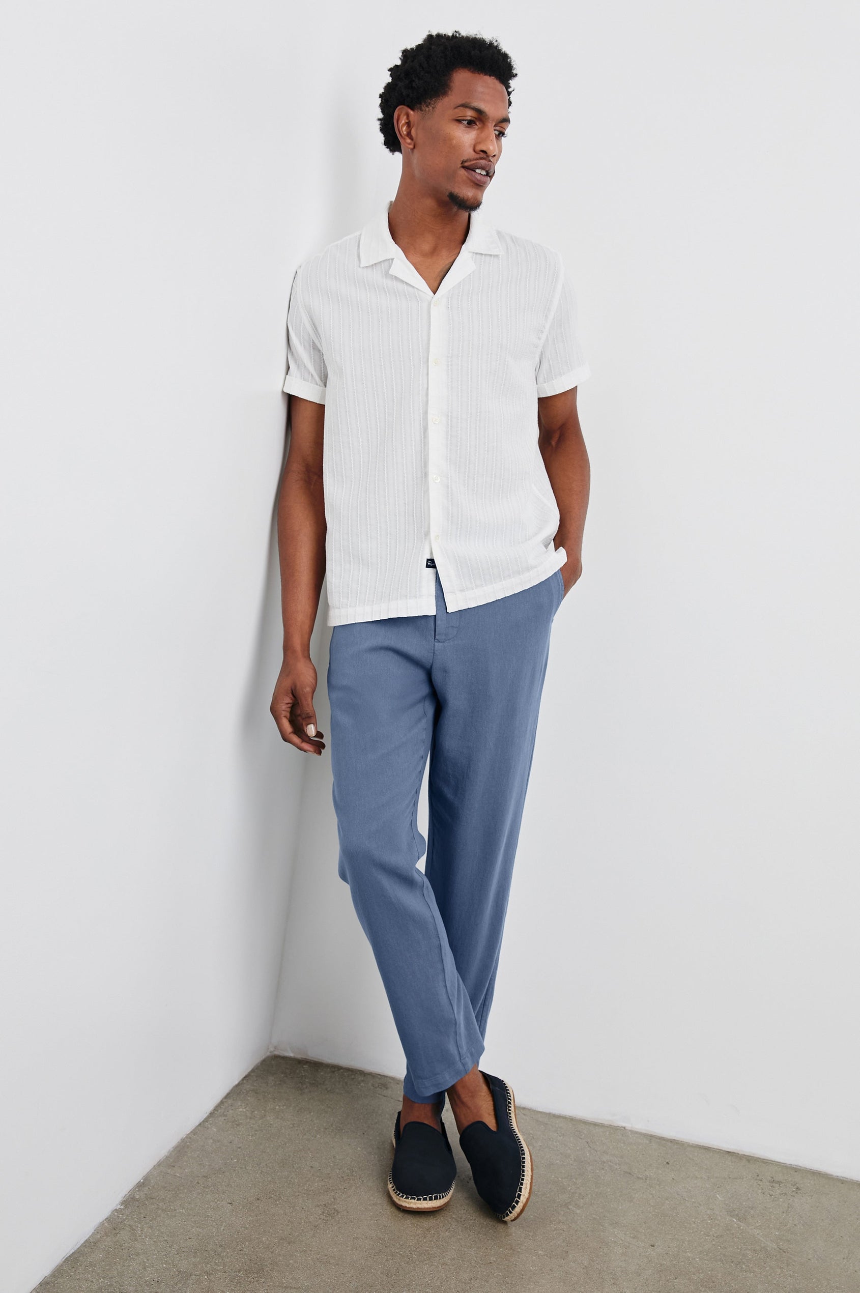 Sinclair lightweight button up short sleeve shirt with subtle stripe texture in White - full body front view on model