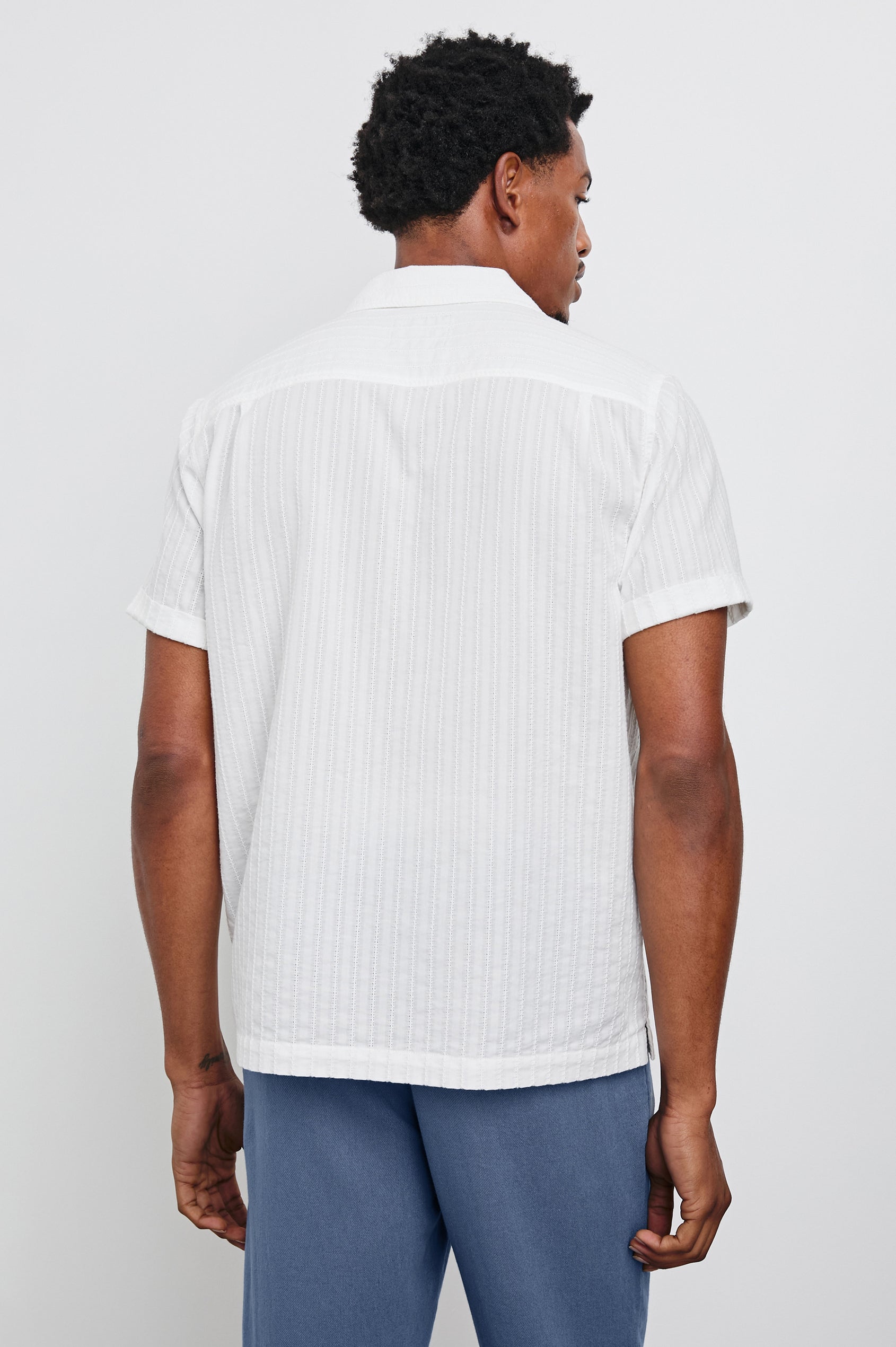 Sinclair lightweight button up short sleeve shirt with subtle stripe texture in White - back view on model