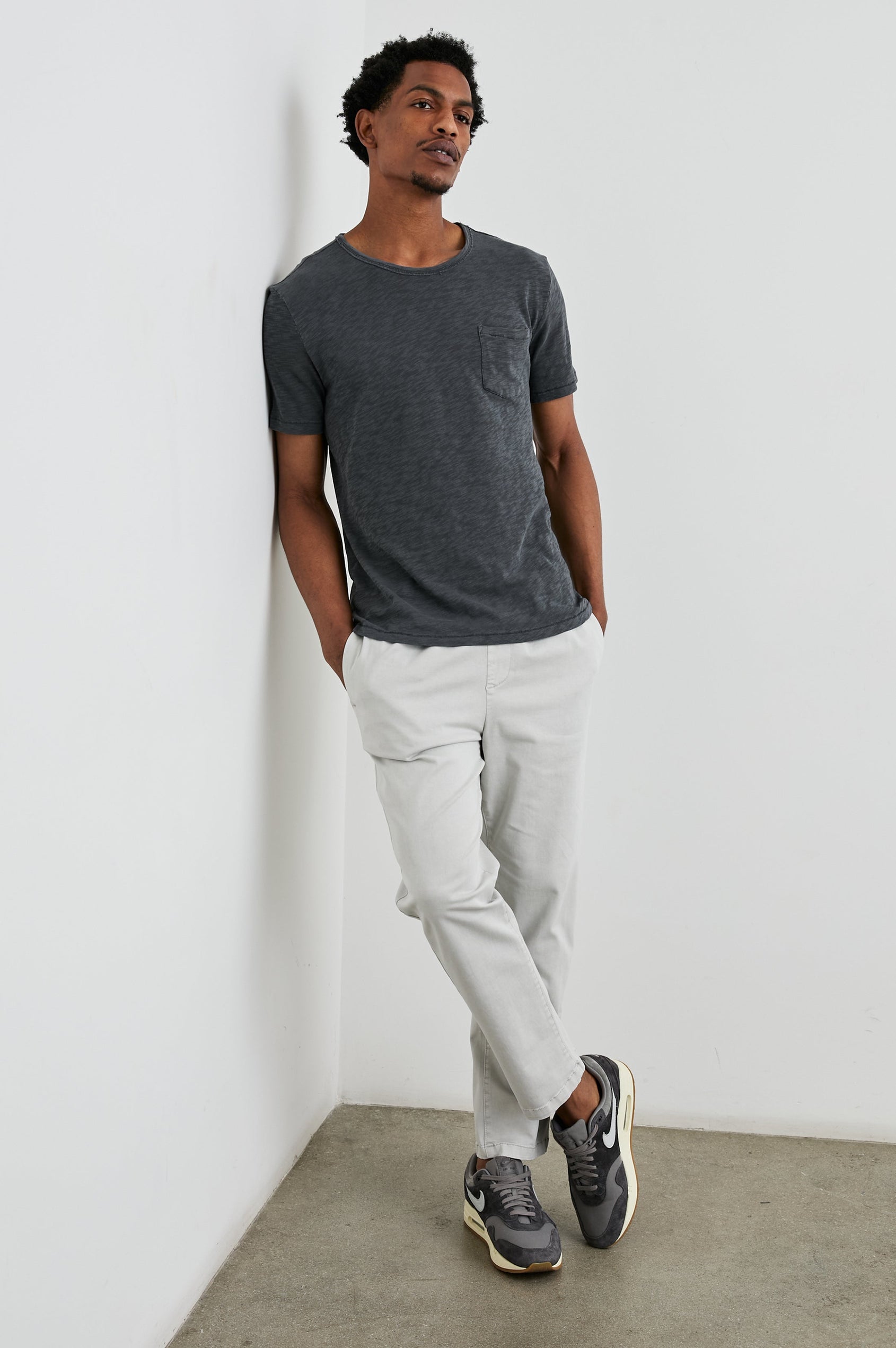 Skipper Short-Sleeve T-shirt with a Crew Neck and a Chest Patch Pocket in Faded Navy Colorway - Front Full Body View Featured on Model