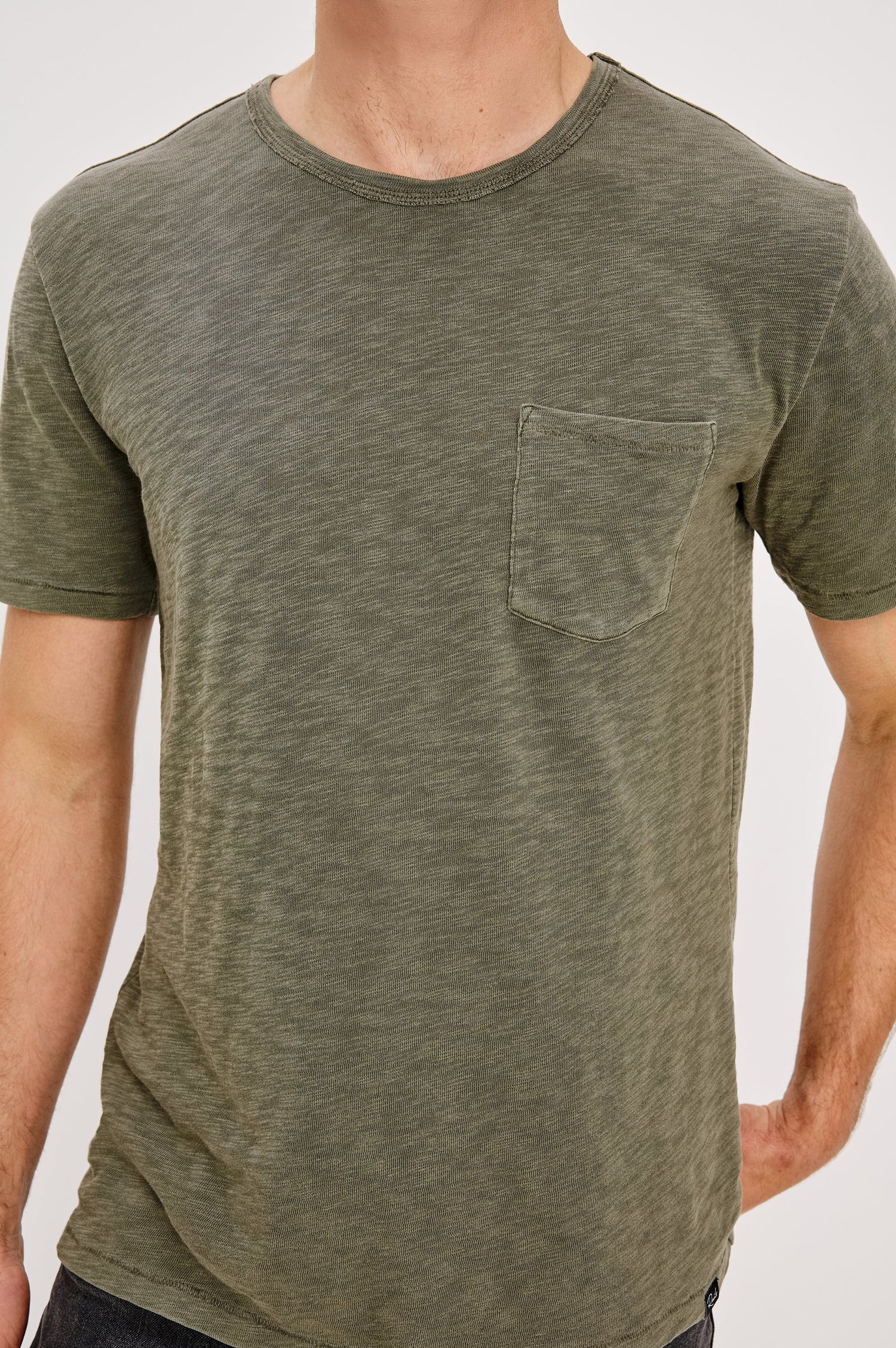 Skipper Short-Sleeve T-shirt with a Crew Neck and a Chest Patch Pocket in Surplus Colorway, a green - Front Detail View Featured on Model