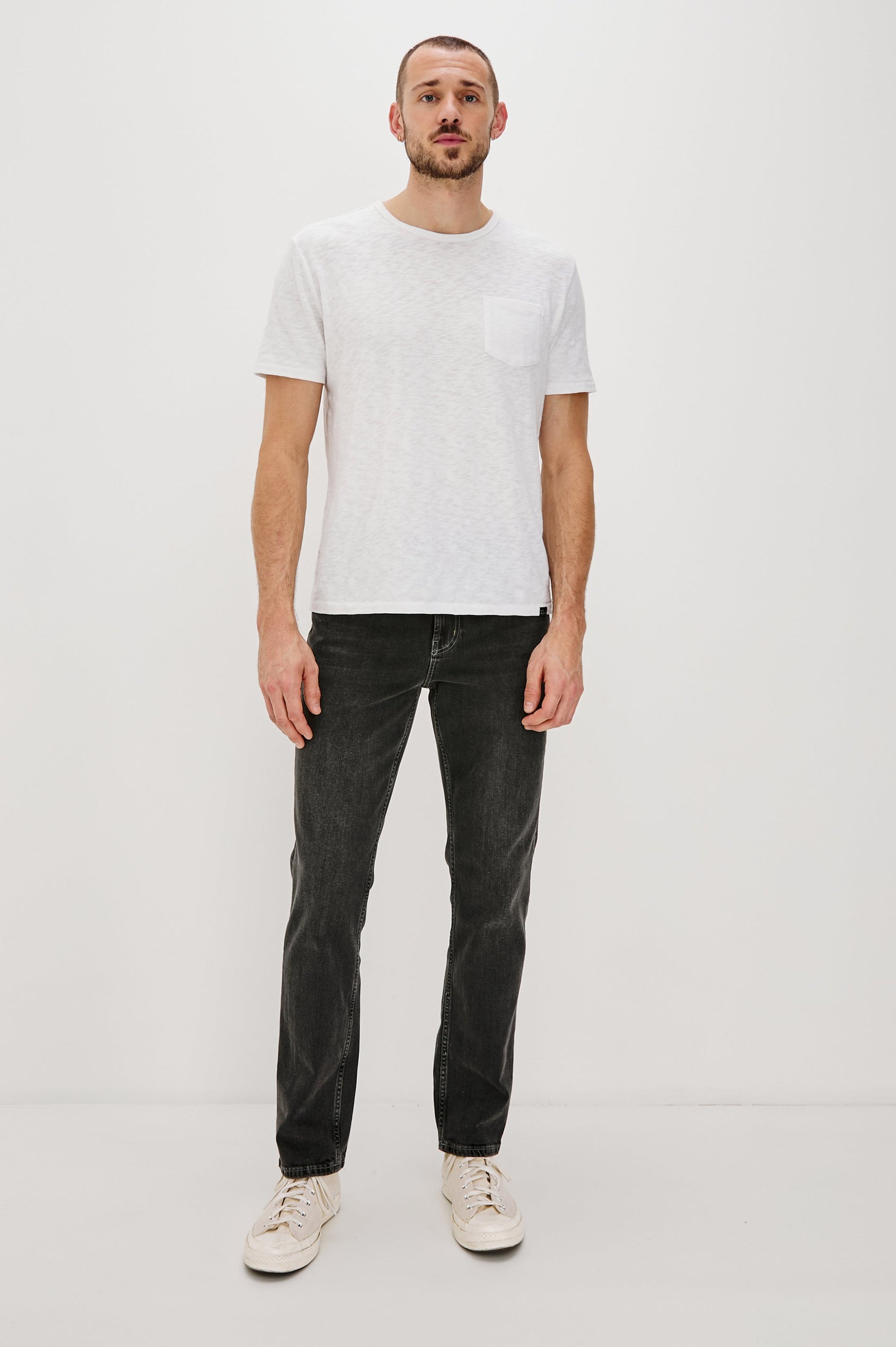 Skipper Short-Sleeve T-shirt with a Crew Neck and a Chest Patch Pocket in White Colorway - Front Full Body View Featured on Model