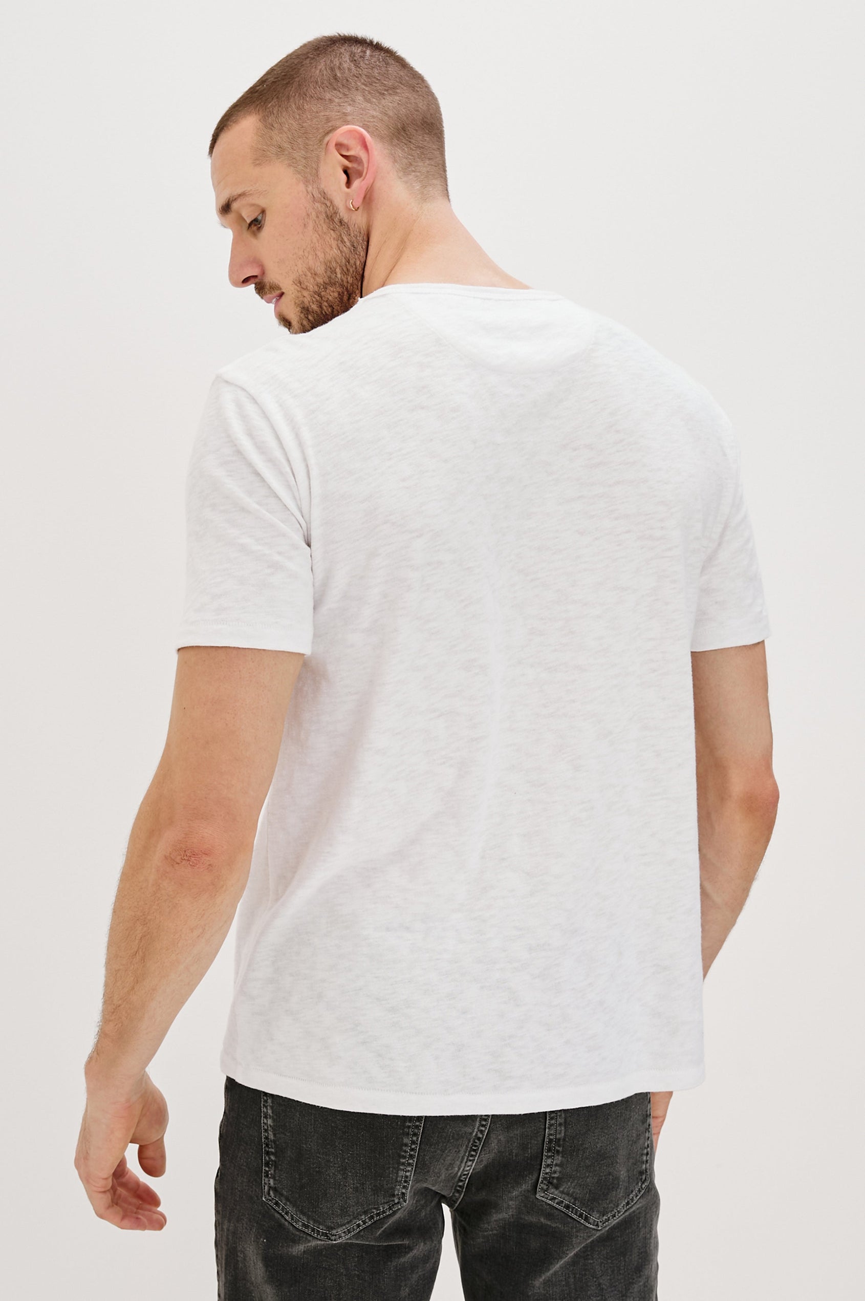 Skipper Short-Sleeve T-shirt with a Crew Neck and a Chest Patch Pocket in White Colorway - Back View Featured on Model