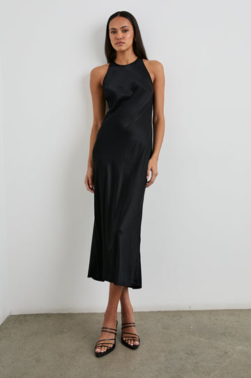 Solene Sleeveless Midi Dress with a Crew Neck and a Tie Keyhole at the Back in Black Colorway - Front Full Body View Featured on Model
