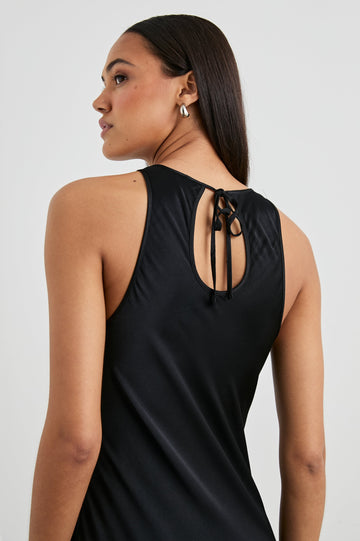 Solene Sleeveless Midi Dress with a Crew Neck and a Tie Keyhole at the Back in Black Colorway - Back View Featured on Model