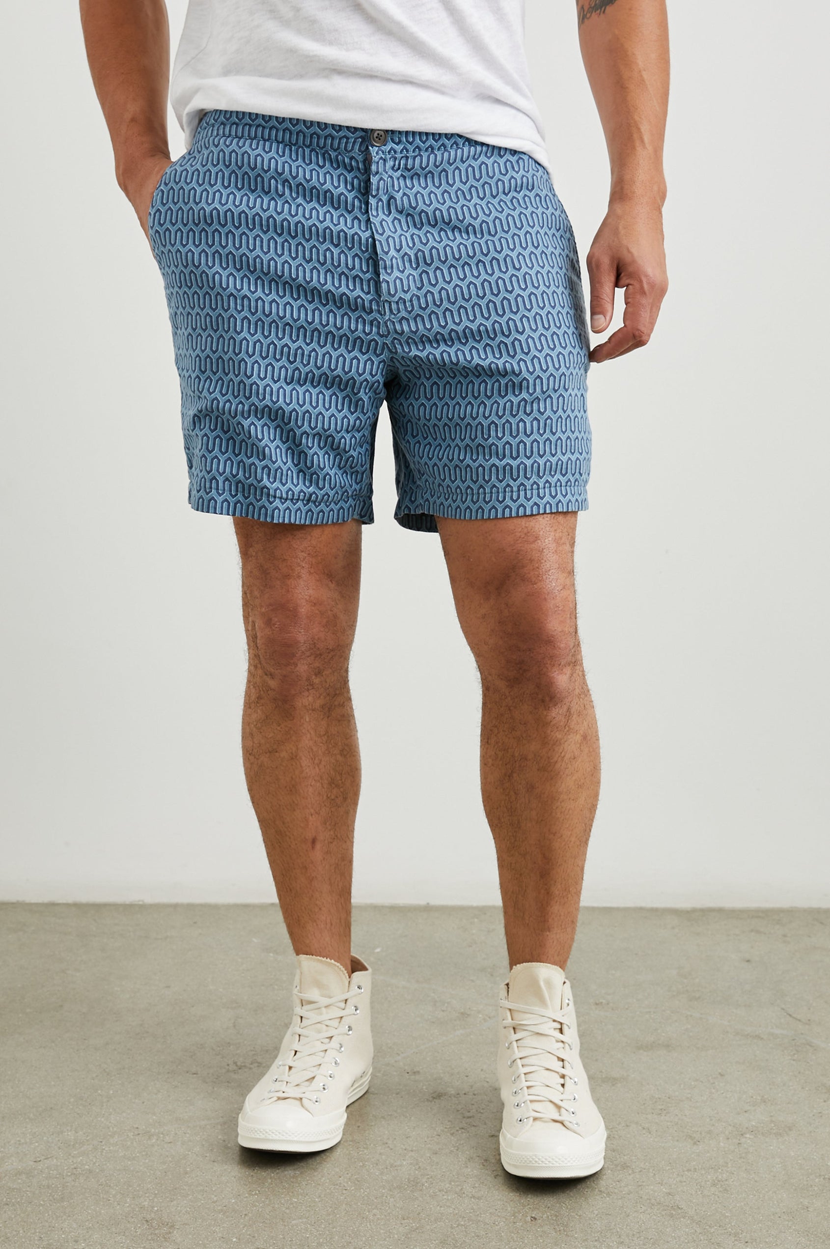 Sona Shorts with Two Front Pockets and Two Back Button Welt Pockets in Wishbone Blues Colorway, a Geometric pattern in Blue on Blues - Front View Featured on Model 