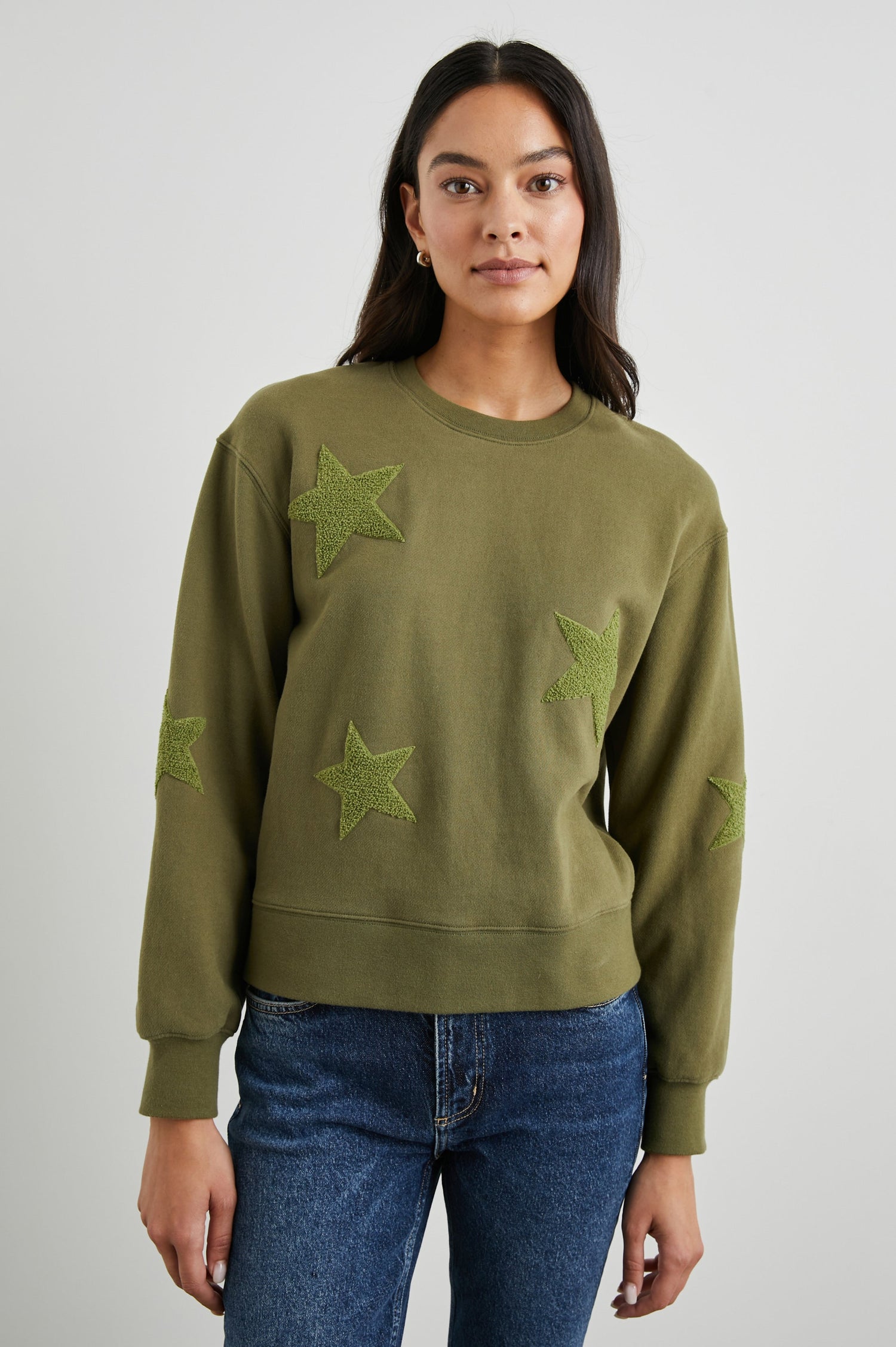 Sonia Long-Sleeve Sweatshirt with a Crew Neck and Patch Stars in Olive Colorway, with stars in a lighter shade - Front View Featured on Model