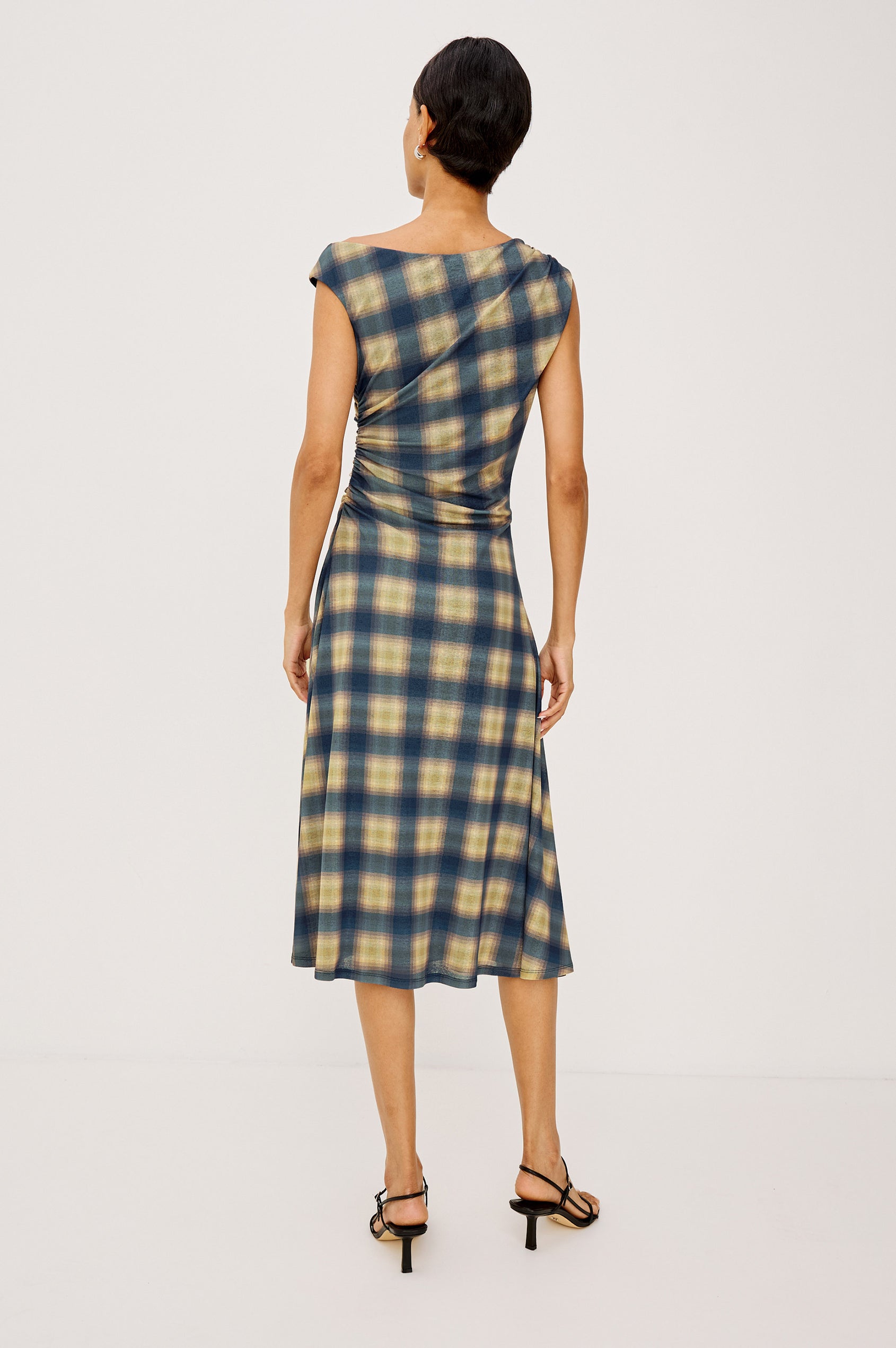 Sorra Midi Dress in Self-Lined Mesh With Asymmetrrical Neckline, Shirred Shoulder Strap, Side Waist Ruching, Bias-Cut Skirt in Navy Sage Plaid Colorway - Full Body Back View Featured on Model