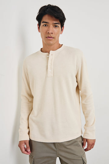 Soto Long-Sleeve Henley with a Four Button Placket and a Crew Neck in Bone Colorway - Front View Featured on Model