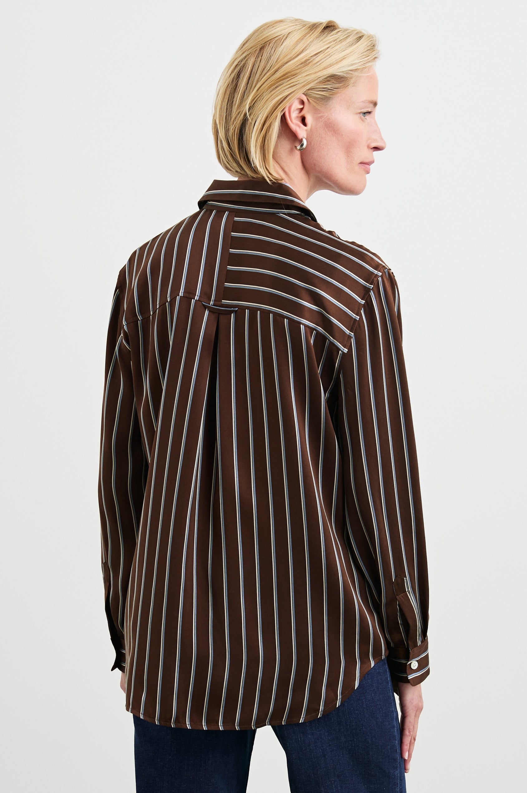 Spencer Long-Sleeve Button Up with Chest Patch Pocket in Baltic White Stripe Colorway, Thin Blue and white mixed vertical and horizontal stripes on Brown - Back View Featured on Model