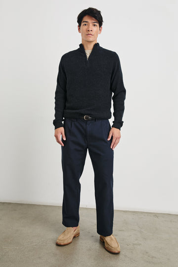 Stark Long-Sleeve Quarter Zip with a Mock Neck, Waffle Torso, and Ribbed Sleeves in Cast Iron Colorway - Front Full Body View Featured on Model