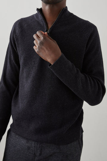 Stark Long-Sleeve Quarter Zip with a Mock Neck, Waffle Torso, and Ribbed Sleeves in Cast Iron Colorway - Front View Featured on Seated Model