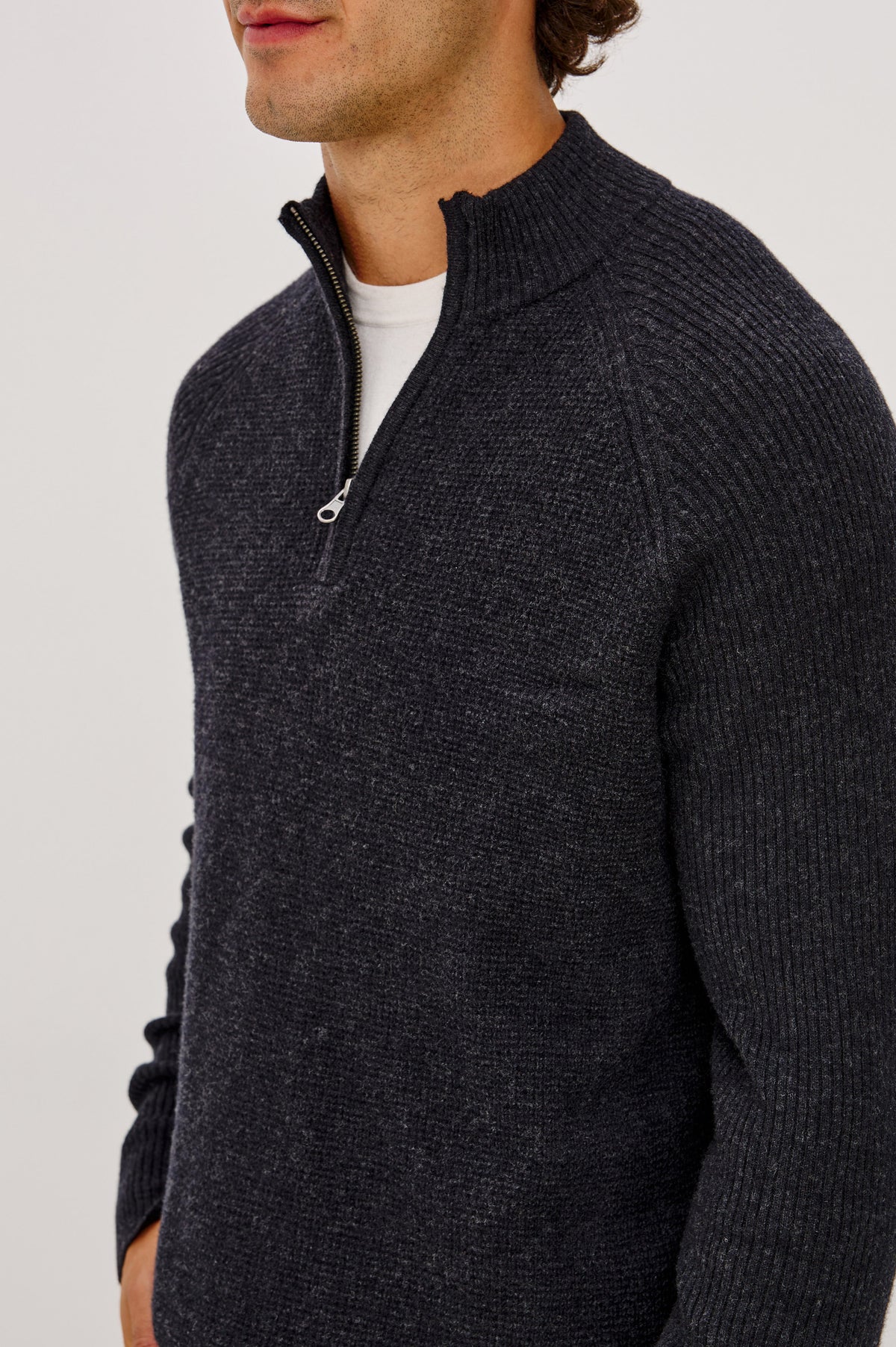 Stark Sweater in Waffle Knit With Quarter-Zip Placket, Mock Neck Collar, and Long Sleeves in Cast Iron Colorway - Upper Body Front Detail View Featured on Model.
