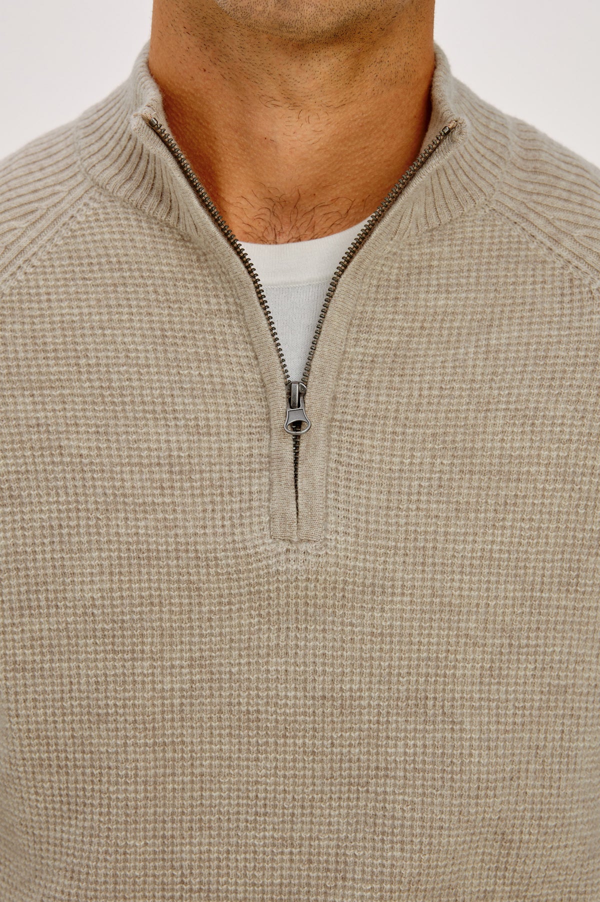 Stark Sweater in Waffle Knit With Quarter-Zip Placket, Mock Neck Collar, and Long Sleeves in Oat Melange Colorway - Upper Body Front Detail View Featured on Model.