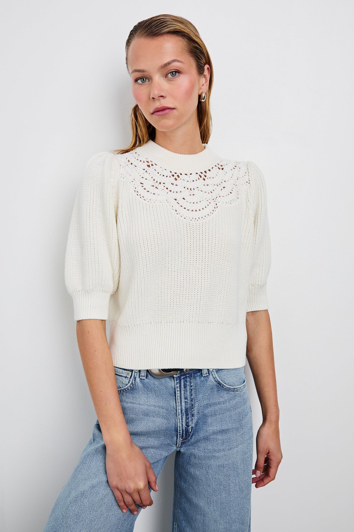 Steph Sweater with Elbow Length Sleeves, Ribbed Trims, a Crew Neck and Crochet on the Upper Chest in White Colorway - Front View Featured on Model