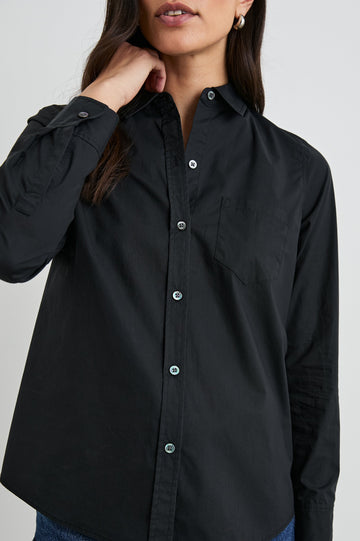 Stina Long-Sleeve Button Up with a Chest Patch Pocket in Black Colorway - Front View Featured on Model