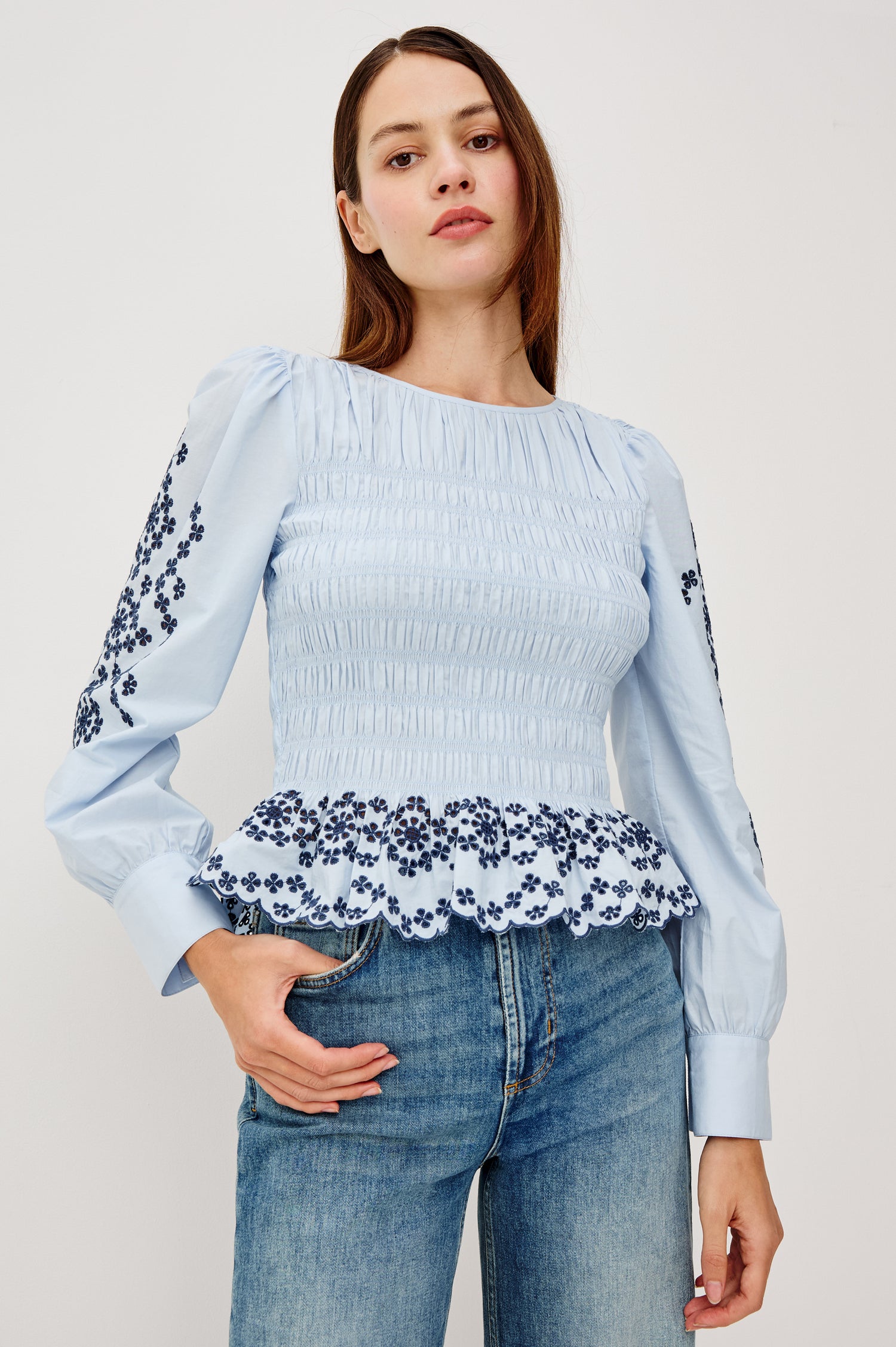 Tabi Blouse Top in Poplin With Smocked Body, Long Puff Sleeves With Fitted Cuffs, Contrast Embroidered Detailing, and Back Keyhole Cutout in Blue Bird Colorway - Upper Body Front View Featured on Model
