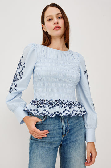 Tabi Blouse Top in Poplin With Smocked Body, Long Puff Sleeves With Fitted Cuffs, Contrast Embroidered Detailing, and Back Keyhole Cutout in Blue Bird Colorway - Upper Body Front View Featured on Model