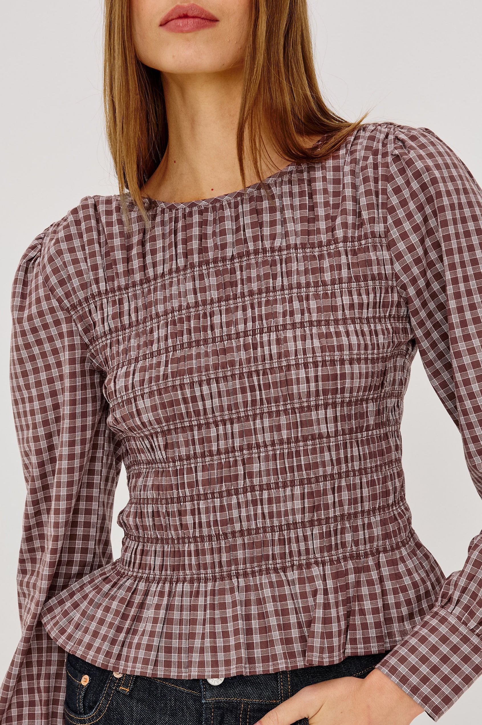 Tabi Shirt in Cotton Poplin With Fitted Smocked Bodice, Flared Peplum Hem, Long Puff Sleeves, and Shirred Neckline in Rust Rose Colorway - Upper Body Front View Featured on Model