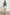 Tafia Top with an Open V-neck, Short Ruffle Cap Sleeves, and a White Blanket Stich along the Neckline, Cuffs and Yoke Seam in Classic Blue Colorway - Front Half-Tucked Full Body View Featured on Model