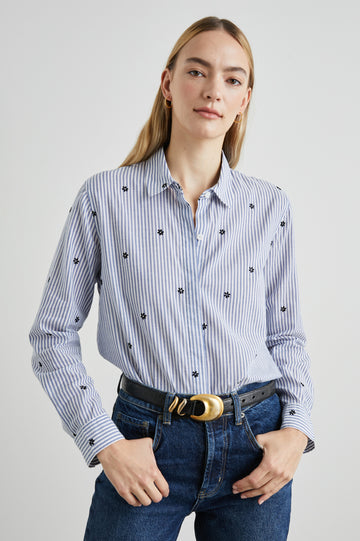 Taylor Long-Sleeve Button Up with Small Dark Navy Daisies in Flocked Daisies Colorway, with Blue and White Vertical Stripes - Front Tucked View Featured on Model