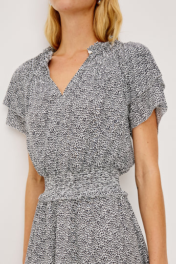 Terrin Mini Dress With Shirred Yoke V-Neckline Tiered Short Sleeves Smocked Waist and Fully Lined Skirt in Ivory Micro Spots Colorway - Upper Body Front Close Up View Featured on Model