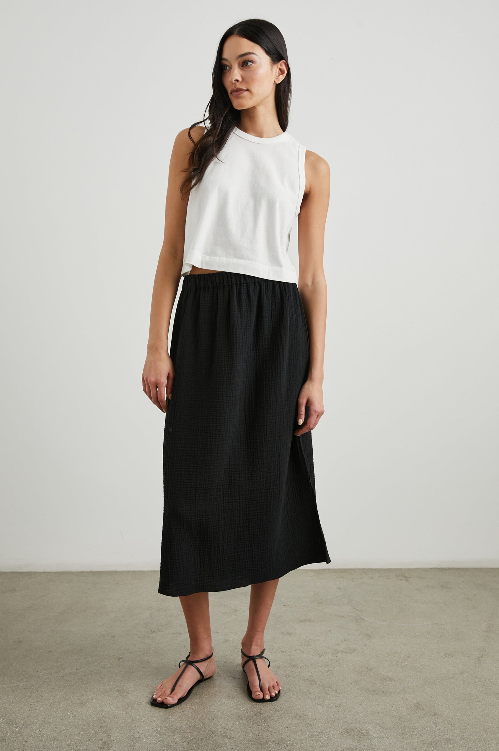 The Boxy Cropped Tank with a Crew Neck in White Colorway - Front Full Body View Featured on Model