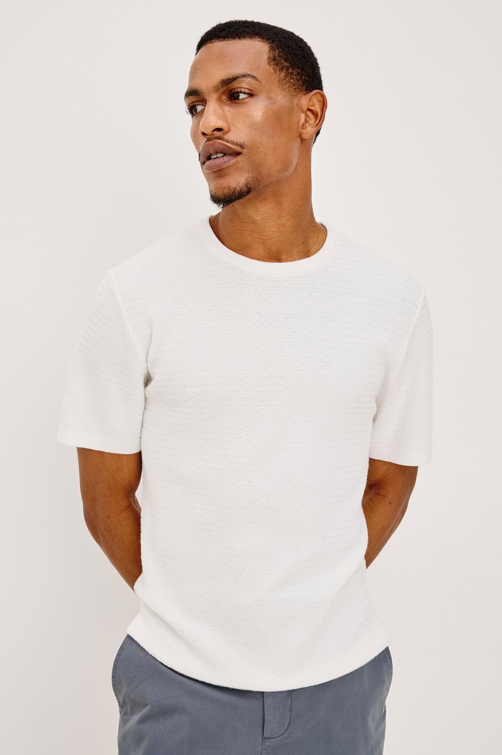 Theo T-Shirt in Ribbed Cotton-Cashmere With Crew Neckline, Short Sleeves, and Classic Fit in Porcelain Colorway - Upper Body Front View Featured on Model