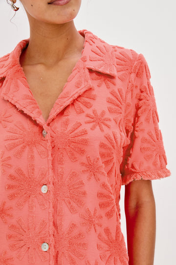 Tiff V-Neck Button Front Shirt with Short Sleeves and Fringed Hems in Red Sunburst Jacquard Colorway. Front Detailed View Shown on Model.